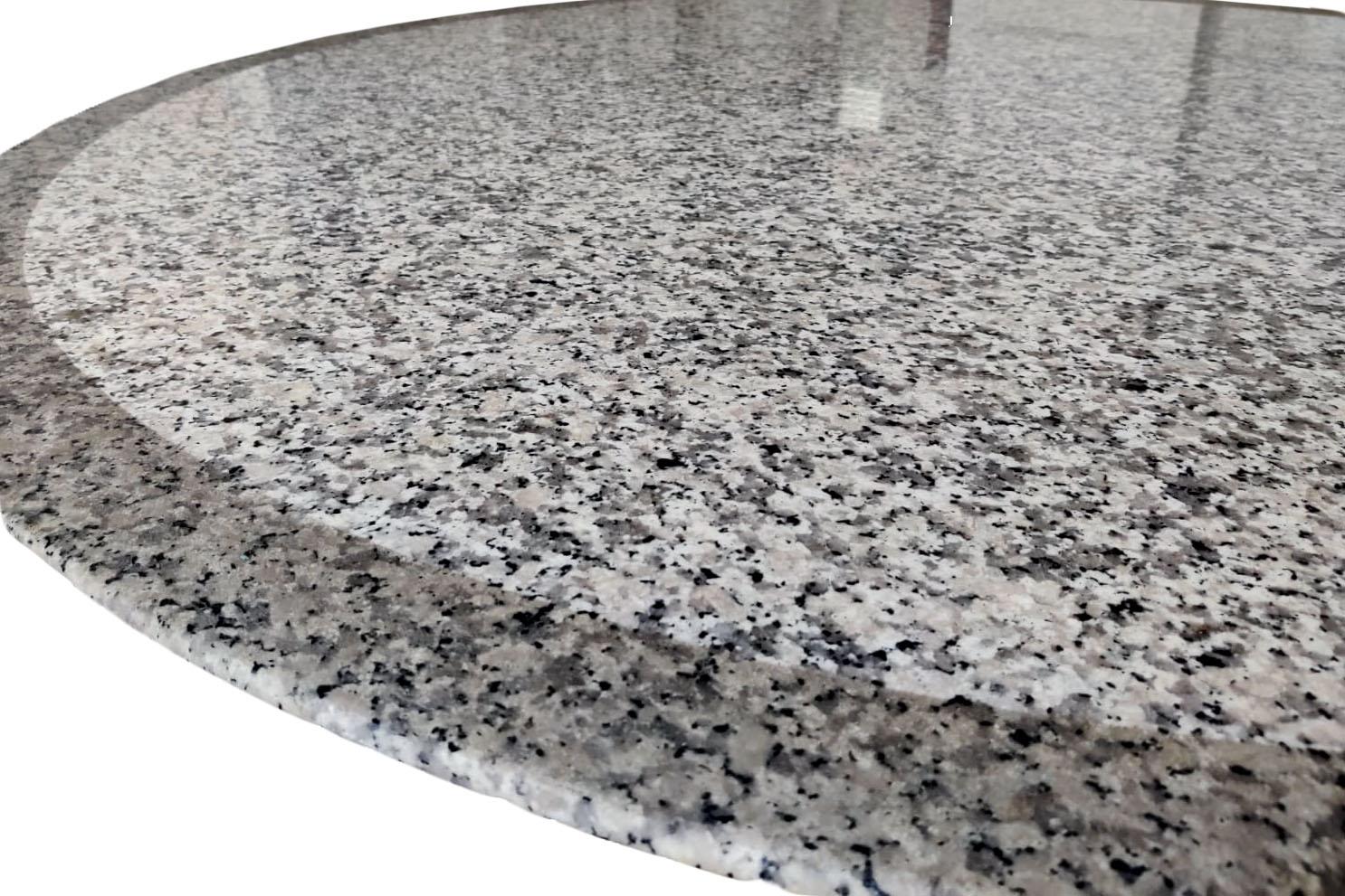 Round table in grey, black and white granite standing on a metallic grey lacquered wood base with three rectangular legs.

Work realized by an architect in the 1970s.