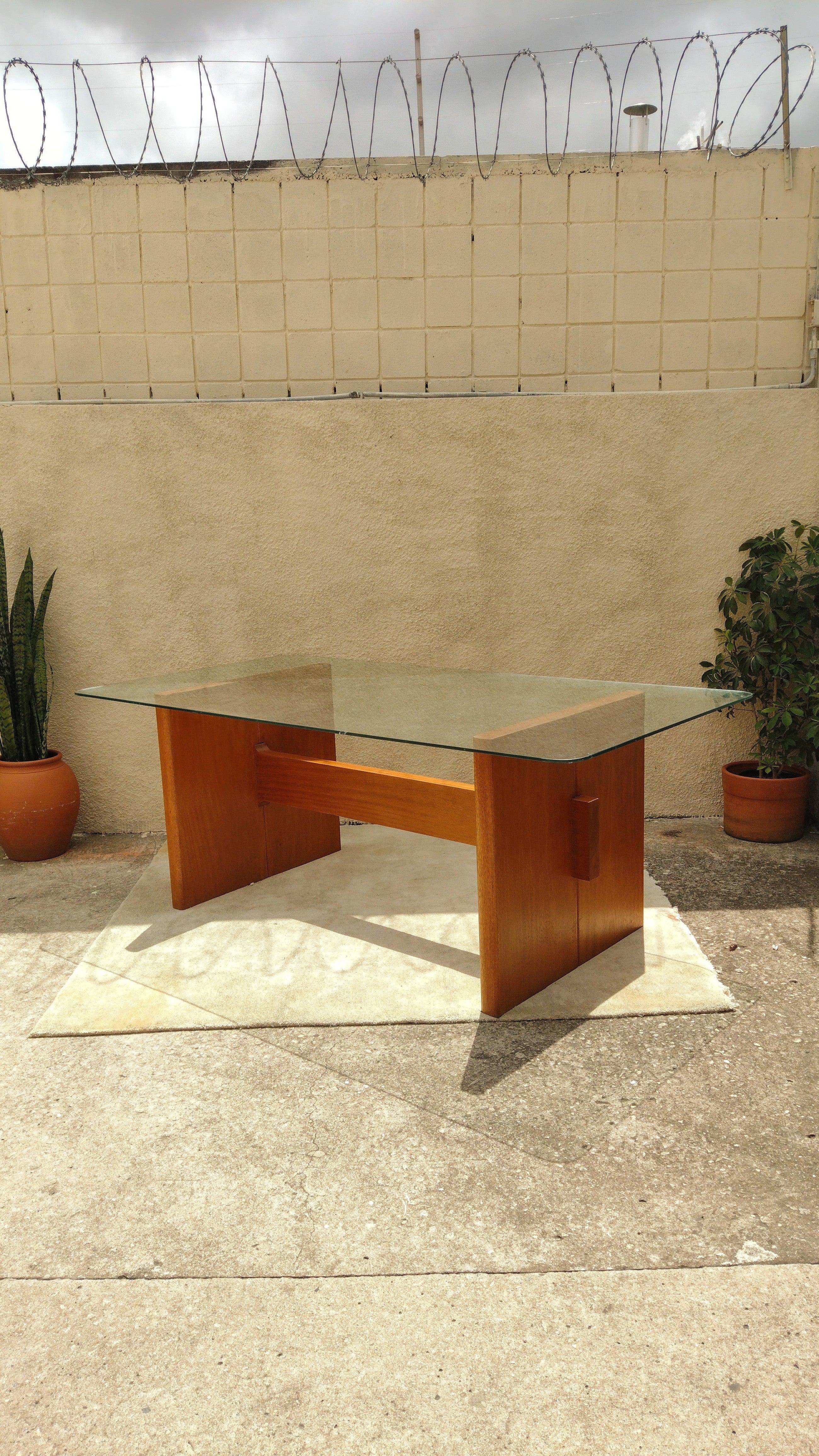 Modern Brazilian table from 1970s in solid cherrywood with tempered glass top. Firm and resistant structure. In good conditions.

Approximate measures:
Height: 81cm / Width: 216cm / Depth: 110cm

Main wear details:*
-Glass has scratches along