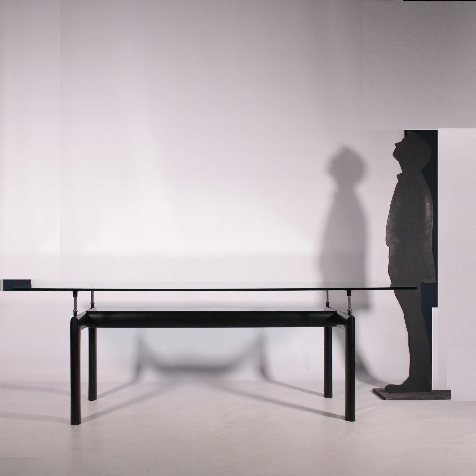 Table projected in 1928 and made in Italy in 1974 by Cassina; lacquered metal base, crystal top.