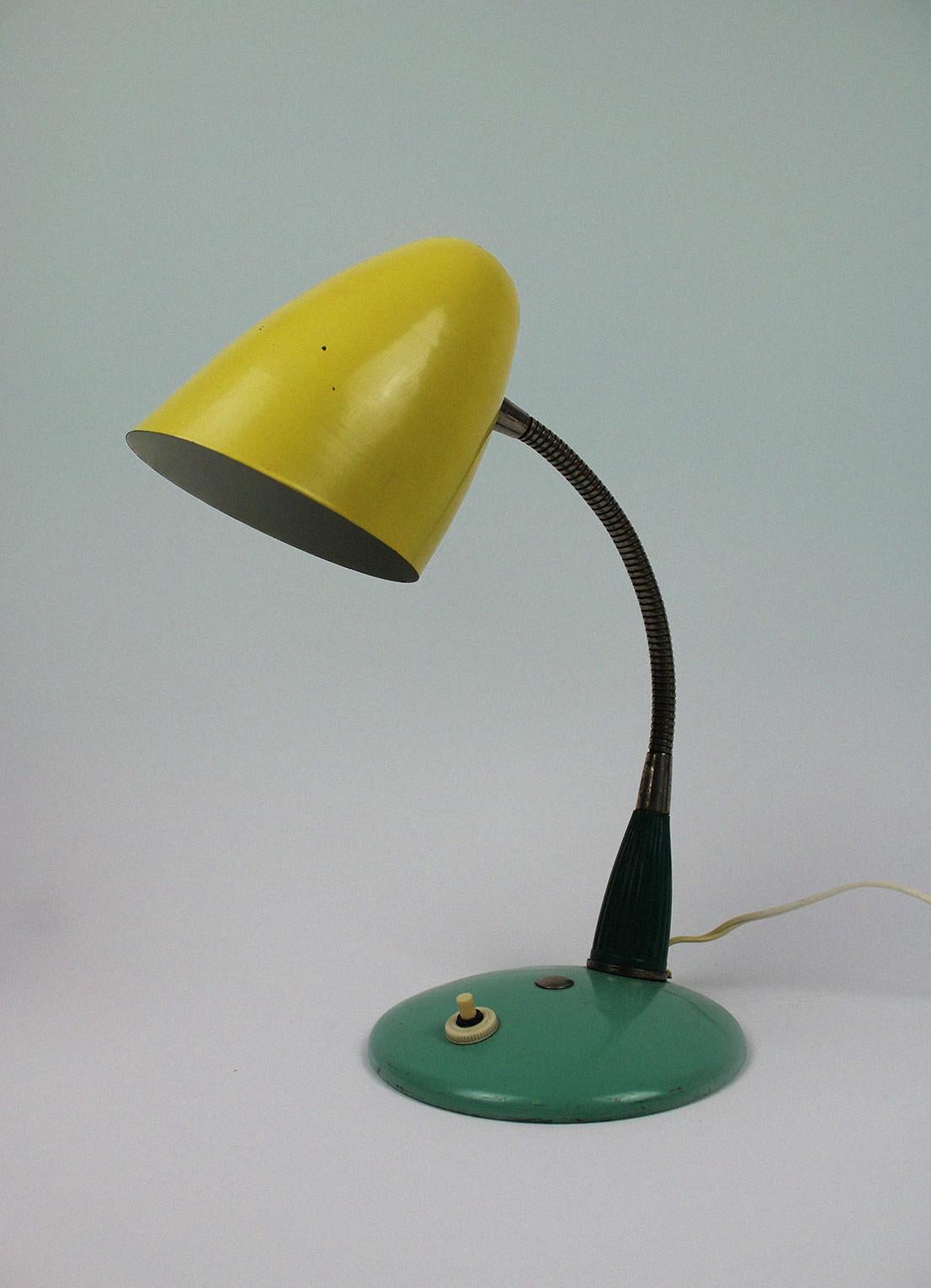 This amazing Mid-Century Table Desk Lamp comes right from its time and creates a fun atmosphere in any kind of interior. These vintage lamps from the 1950s and 1960s were hugely popular in Poland & russia and were often used as photo studio Lighting