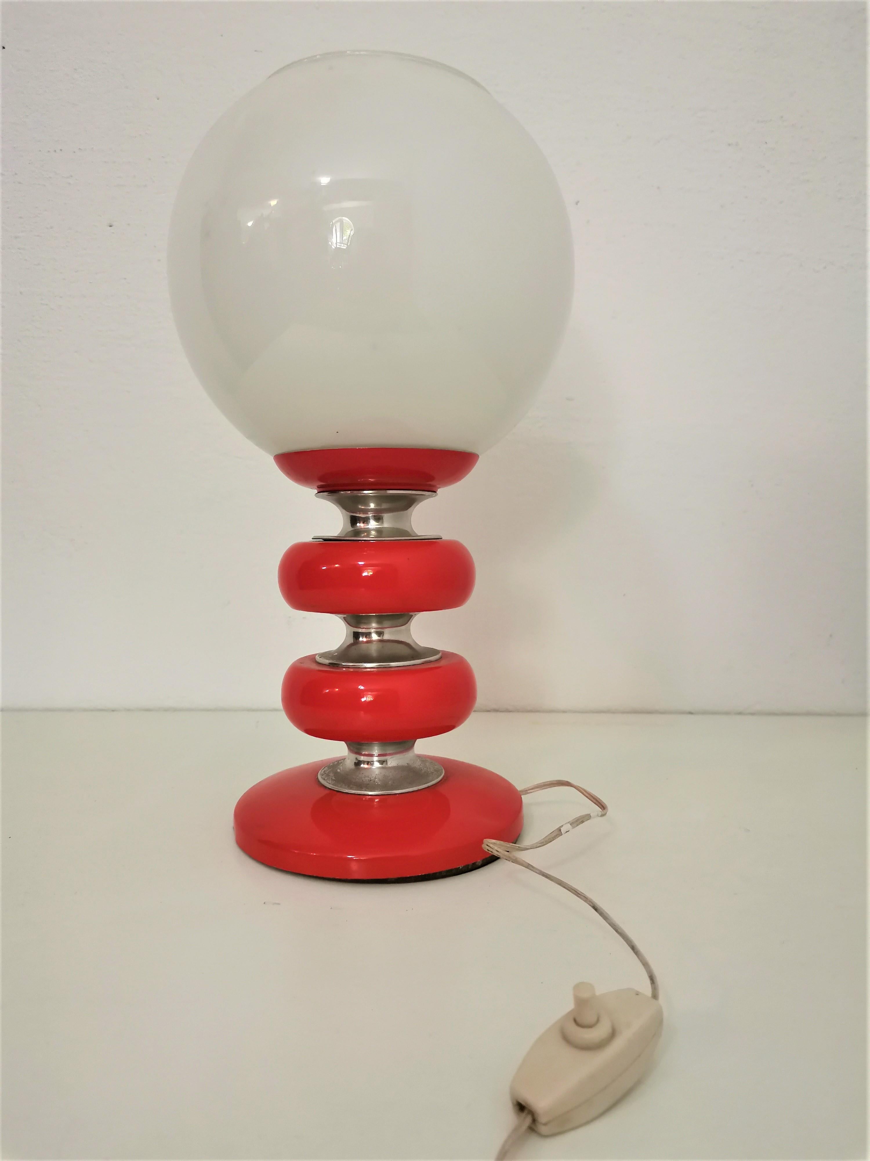 Table lamp

Period: 1970s

Country of Manufacturer: Italy

Materials: wood, metal parts, opaline glass

Colours: red, white, chrome

Condition: very good original vintage condition, fully functional

Style: midcentury modern, Classic.