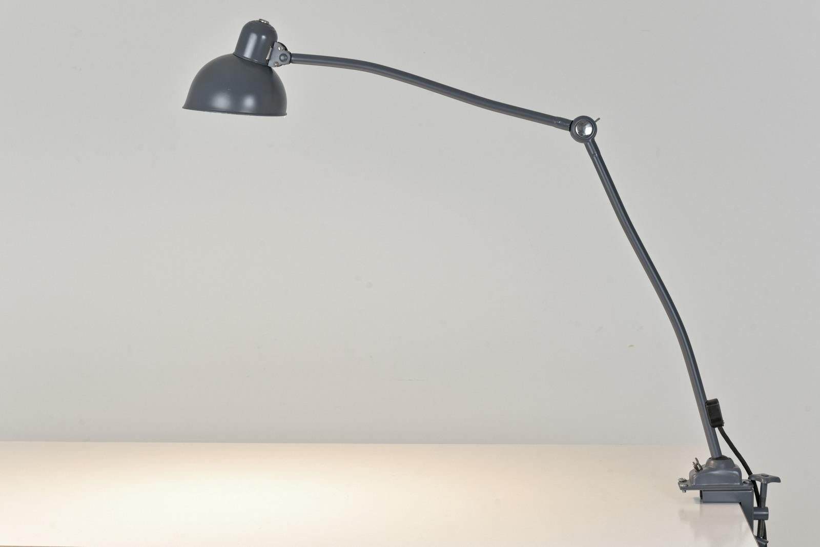 Dimensions: H 75 cm W 100 cm D 16 cm

Material: Iron tubes, sheet iron painted industrial gray, one socket E 27, connection box bakelite, connection cable 3-core textile-sheathed, cord switch, Schuko plug bakelite

Condition: good original