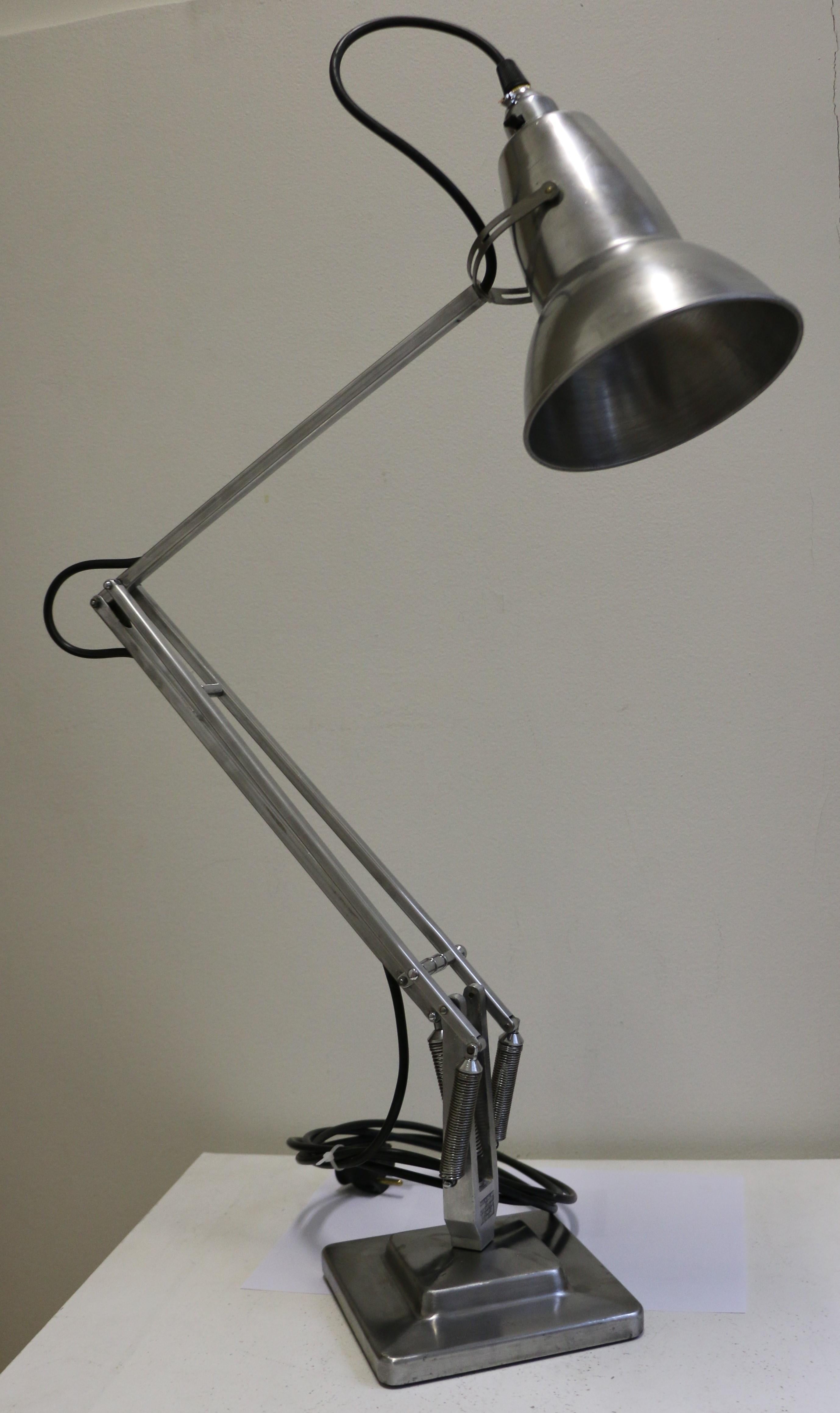An Anglepoise desk lamp by Herbert Terry, designed by George Cawardine in the 1930s in the UK. This piece dates from the 1950s and is presented in an industrial style i.e. with polished metal. Wiring has been renewed as is the chrome bulb holder