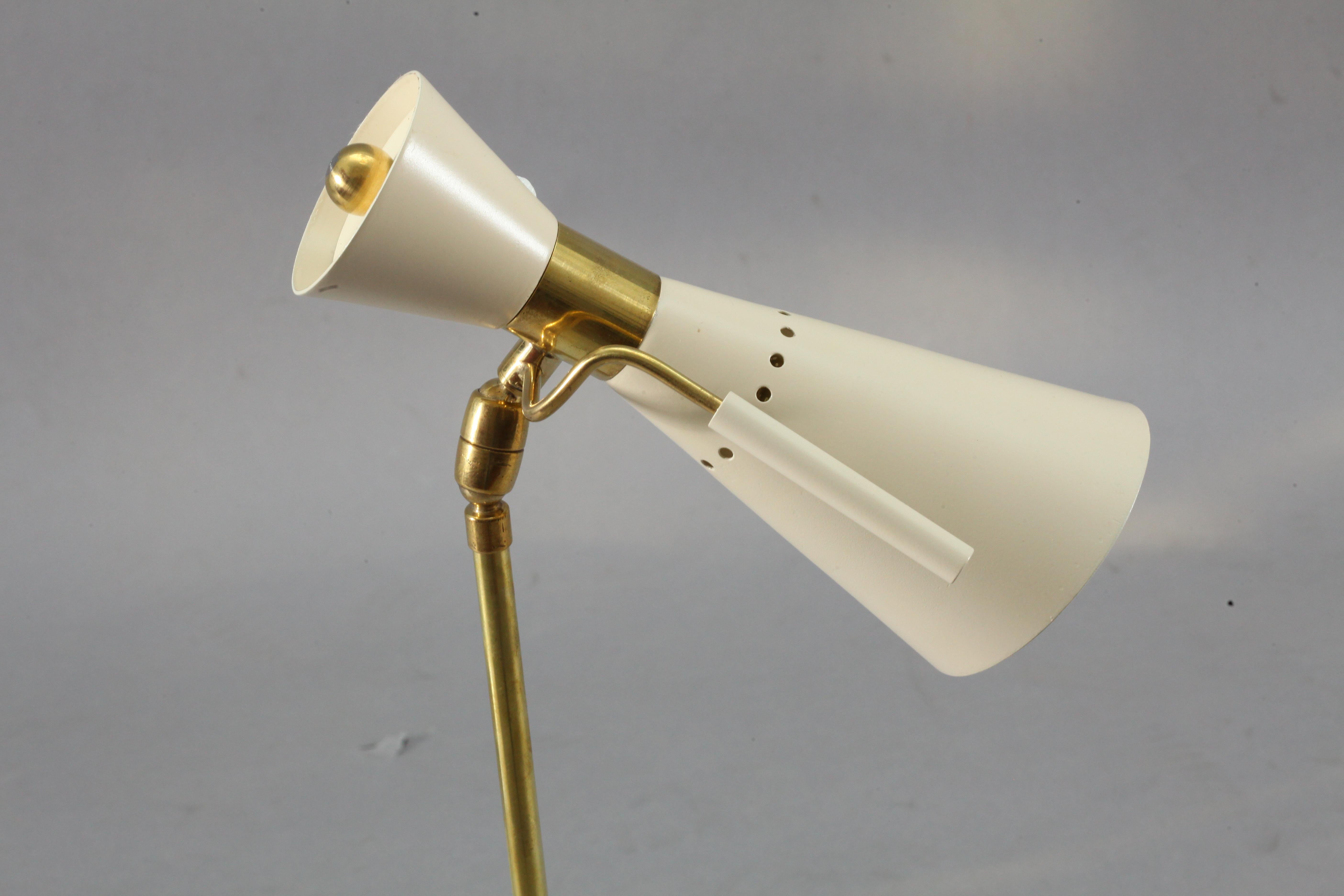 Table lamp,
attributed to Angelo Lelli
Italy, 1950.
Brass base and stam,
movable shade with brass hand grip.