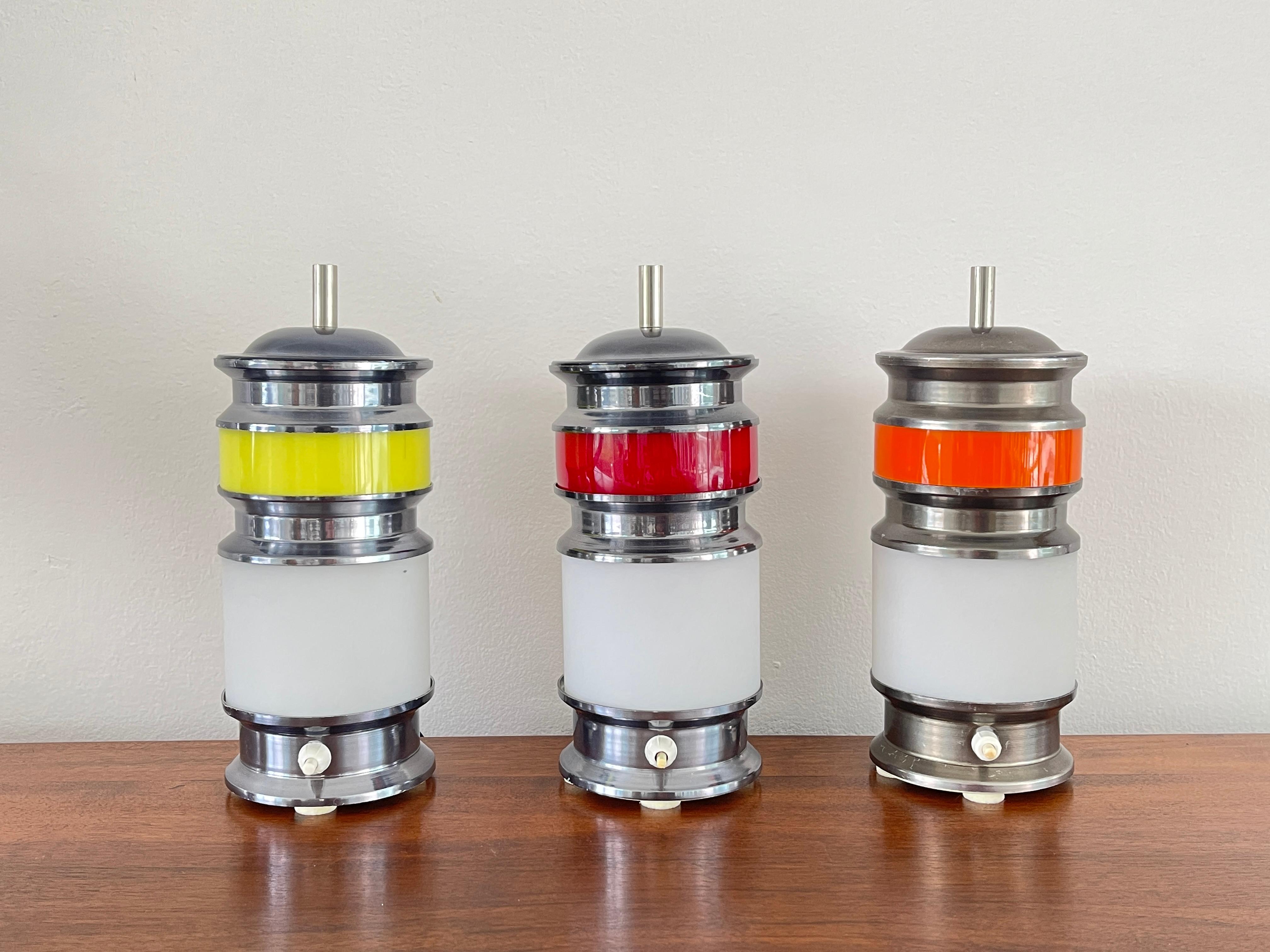 Table lamps attributed to Gioffredo Reggiani
Brushed aluminum, opaque milk glass & acrylic. 
Great scale and beautiful when lit.
Italy, 1960's - priced individually 

Total of 7 available - 
Orange - 2x
Red - 1x
Yellow -4x.


 