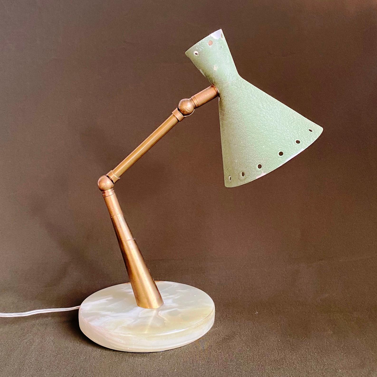 Nice adjustable table lamp in original unrestored condition.
Nice marble base and pale green aluminum shade, brass adjustable support.
Some paint fading and scratches are present but in working condition.
Equipped with one E14 fitting and 2 pin