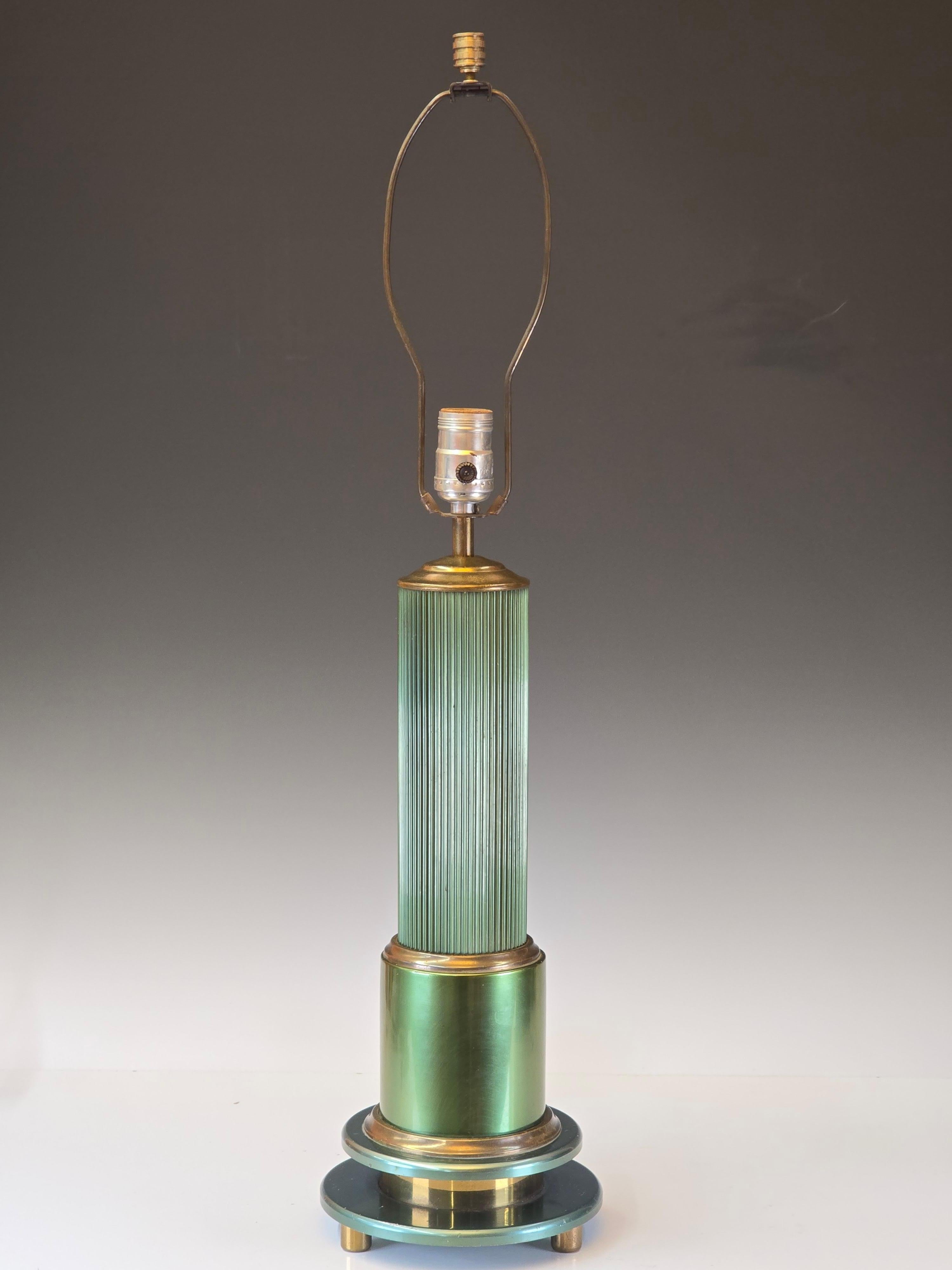 Stunning machinist lamp by workers at Alcoa which dates from the mid to late 1930s.   Has a wonderful art Deco style and spectacular faded green anodized finish which looks wonderful next to the aged brass finish.  This lamp is most likely a one of