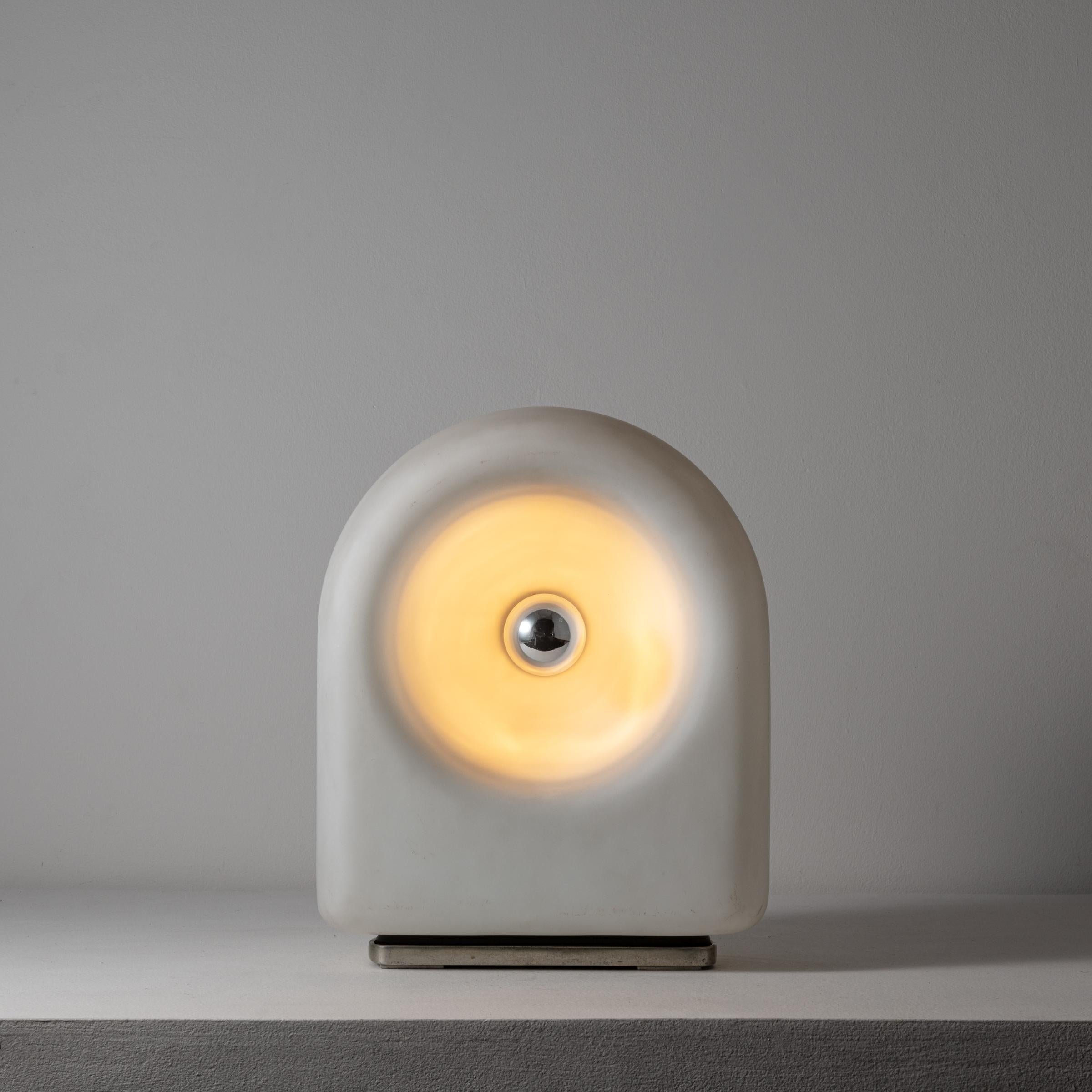 Table lamp by Claudio Salocchi for Lumenform. Designed and manufactured in Italy, 1968. Metal, blown Opal glass. Original EU cord.
Recommended Lamping: 120v - 1 Qty E27 Socket w/ a 60w Silver Capped Bulb. 
 