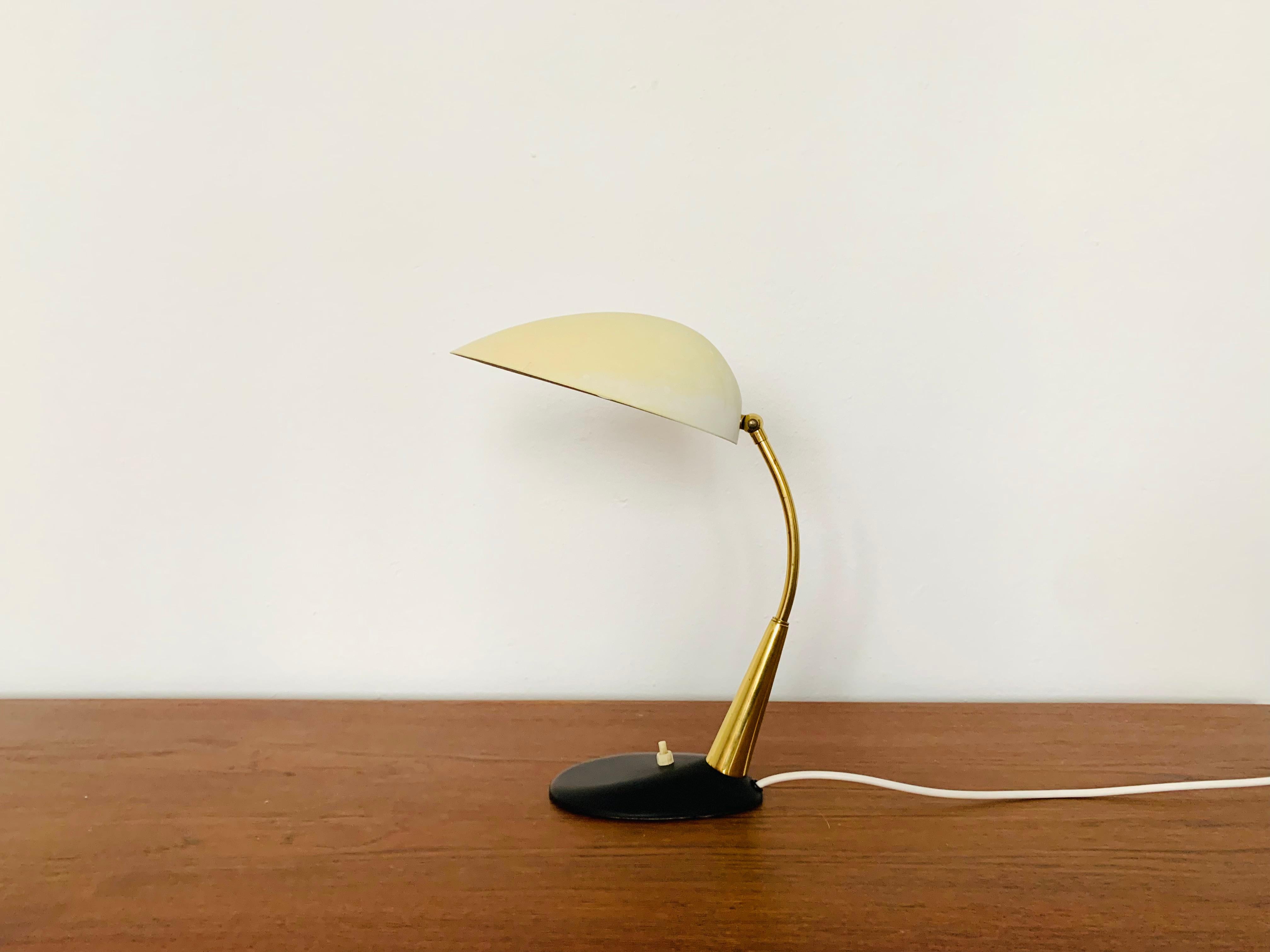 Pretty table lamp by Cosack from the 1950s.
Fantastic mid-century design.
The combination of high-quality workmanship and loving details enriches every home.

Manufacturer: Cosack

Condition:

Very good vintage condition with slight signs of wear