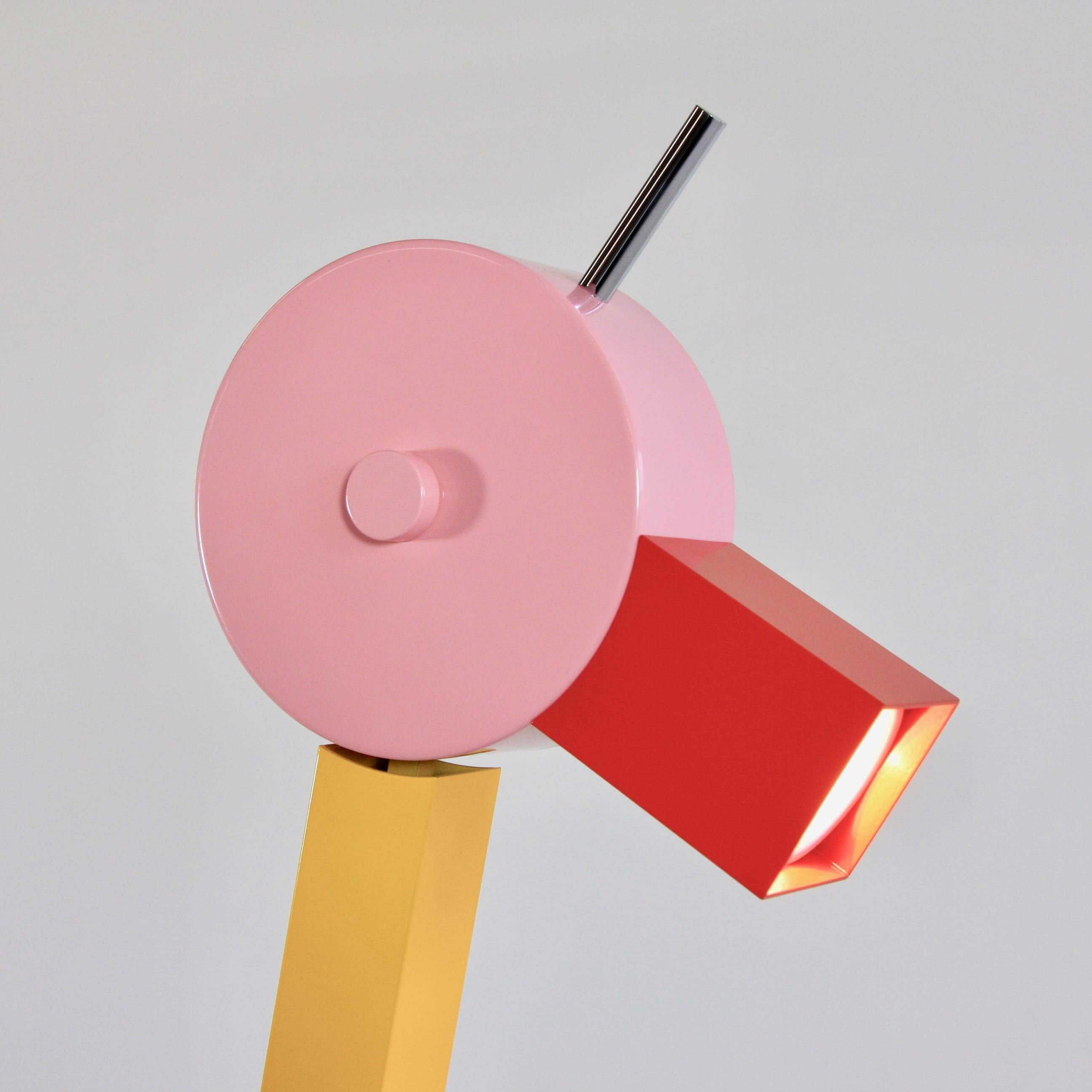 Tahiti table lamp, designed by Ettore Sottsass, Italy, 1981.

Metal construction, wooden base with laminate and head with halogen lamp, 'The Duck'. With original metal label.

Reference: Fiell. 1000 Lights. 1960 to present. P. 316,