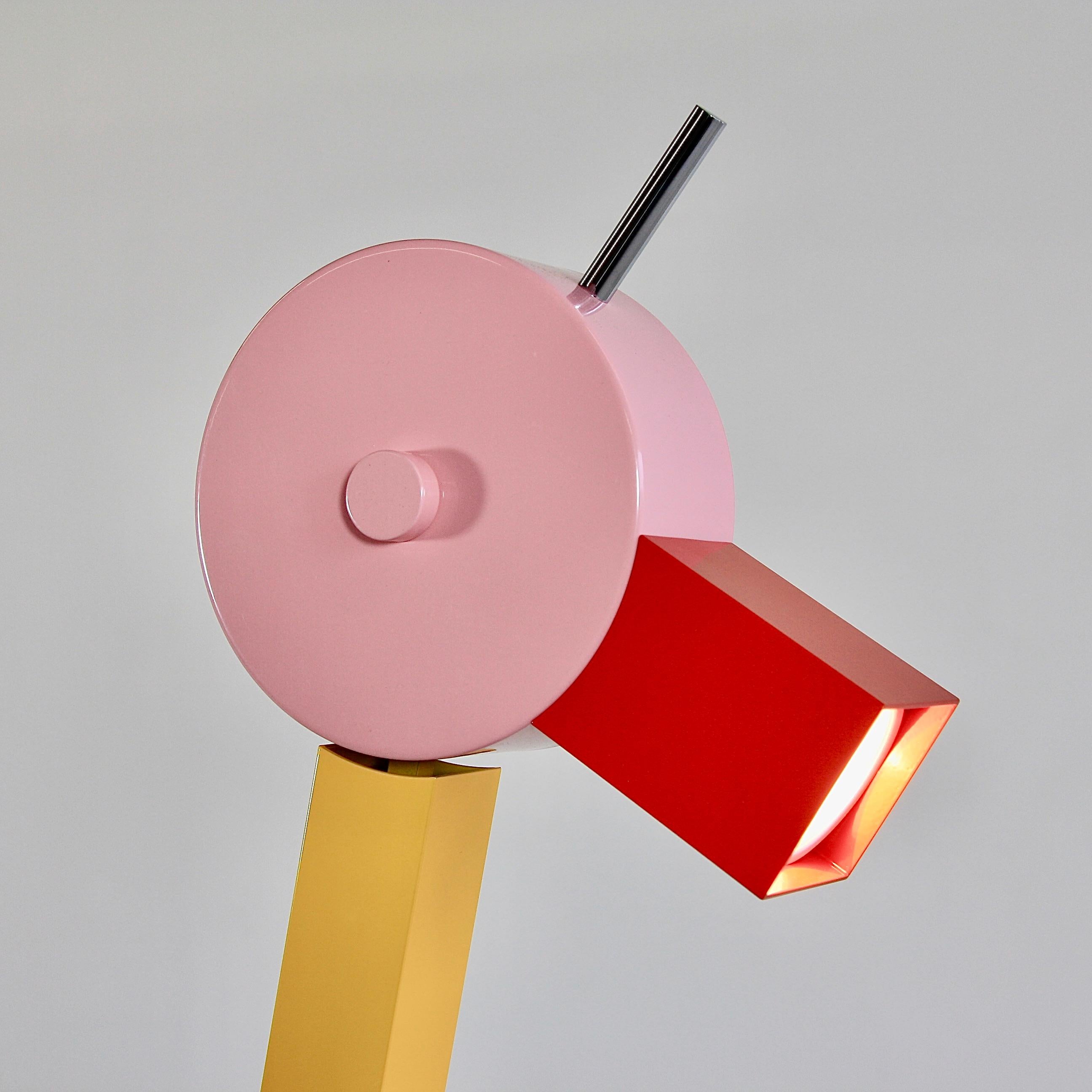 Tahiti table lamp, designed by Ettore Sottsass, Italy, 1981.

Metal construction, wooden base with laminate and head with halogen lamp, 'The Duck'. With original metal label.

Reference: Fiell. 1000 lights. 1960 to present. P. 316,