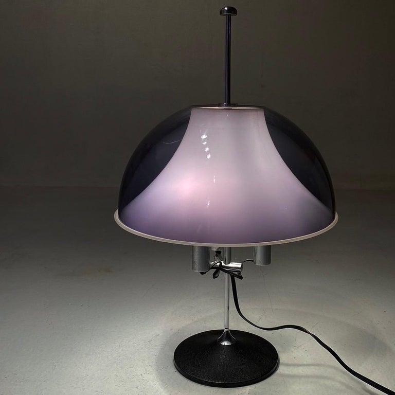 What a beautiful and elegant table lamp made in Italy by Stilux and designed by Gino Sarfatti in 1970s.

Trompet shaped cast iron base that leads up to the chrome plated base rod with three light sources. The shade consists of two parts. The inner