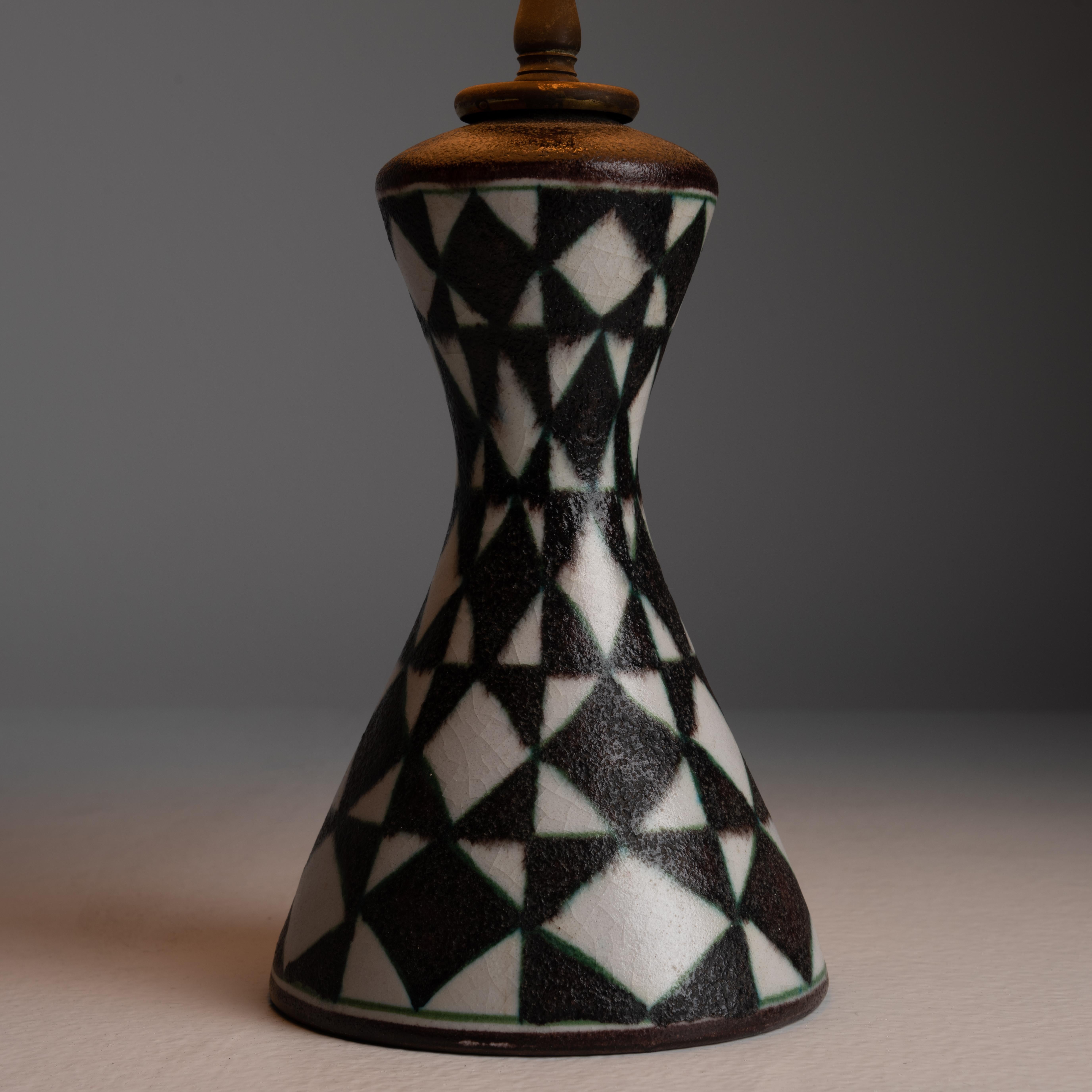 Table lamp by Guido Gambone. Designed and manufactured in Italy, circa the 1960s. Geometric ceramic base paired with a black silk shade. Consists of a single E12 socket type. We recommend one 40w max bulb. Bulb not included. Sold as a single unit.
 