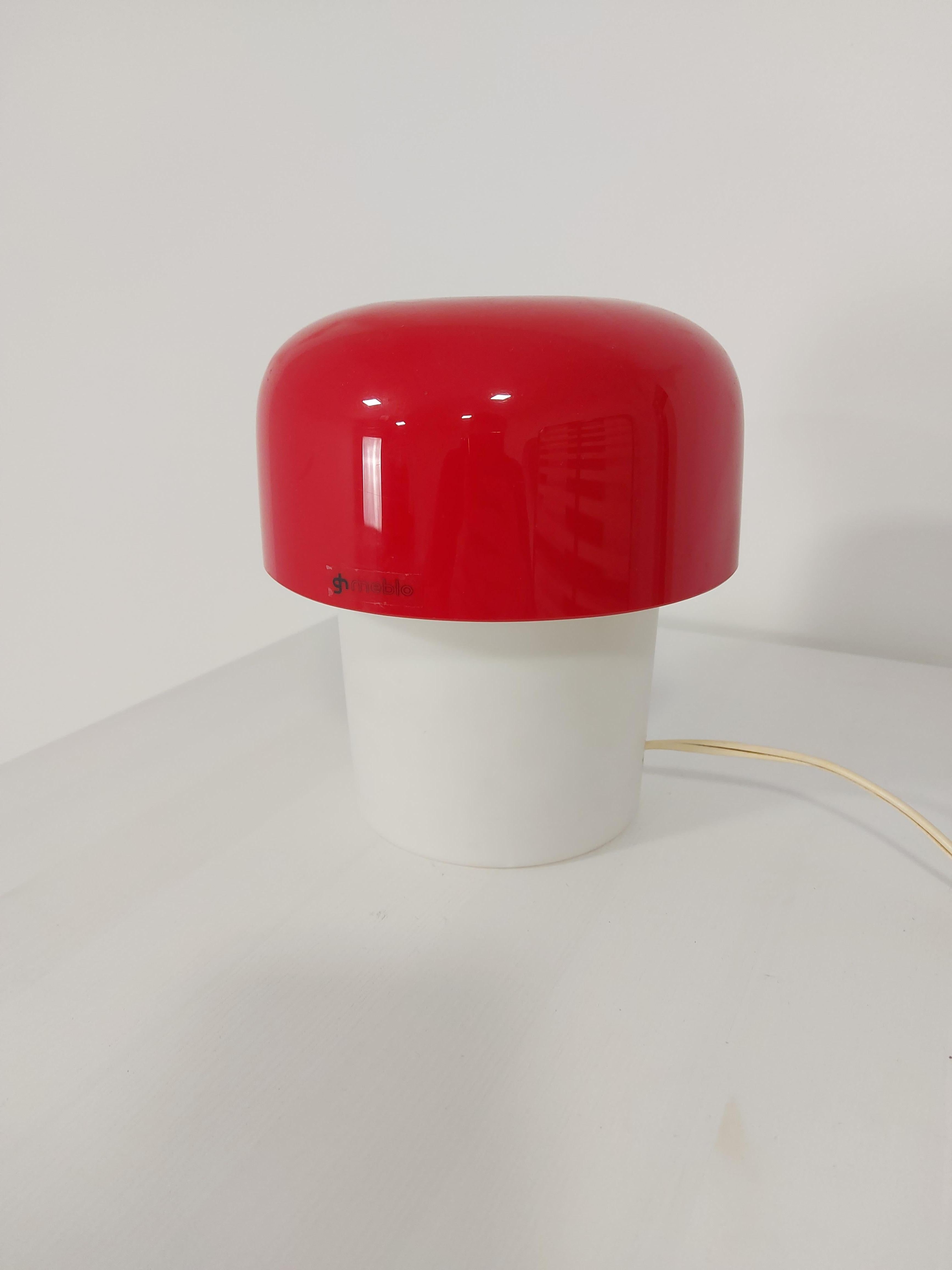 Elegant Harvey Guzzini lamp by Meblo in the 70’s. This is a small and rare lamp in good condition, it works perfectly. The lamp creates warm atmosphere. Nice little lamp from the 70’s. H-17 cm, W-16 (11) cm.