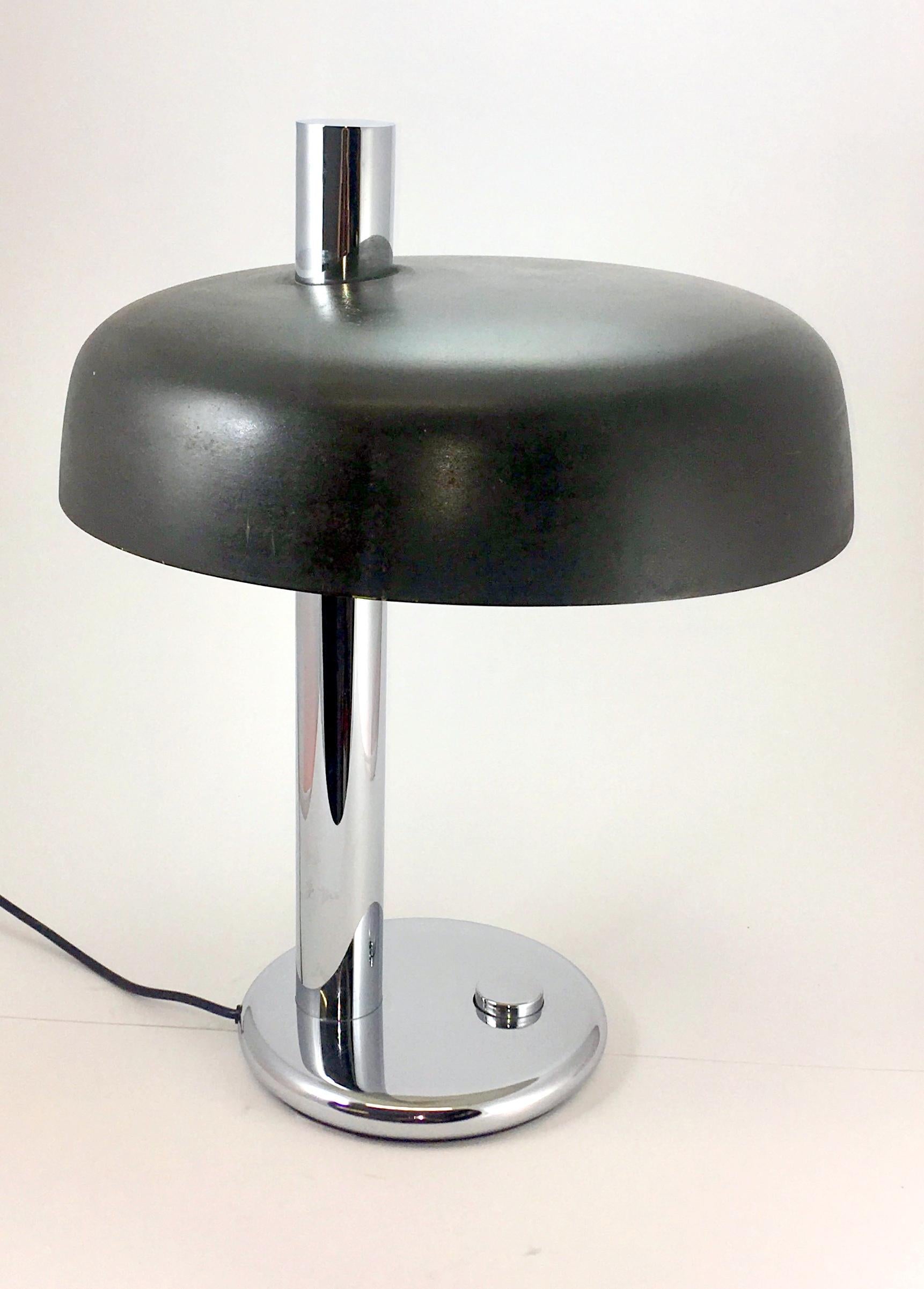 Chrome round base with a big built-in switch. Painted aluminium lampshade, painted white inside. Thick chromed metal rod. Some metal and brass parts. 2 galvanised metal E27 sockets. With very light scratches (last two photo)
Manufacturer: