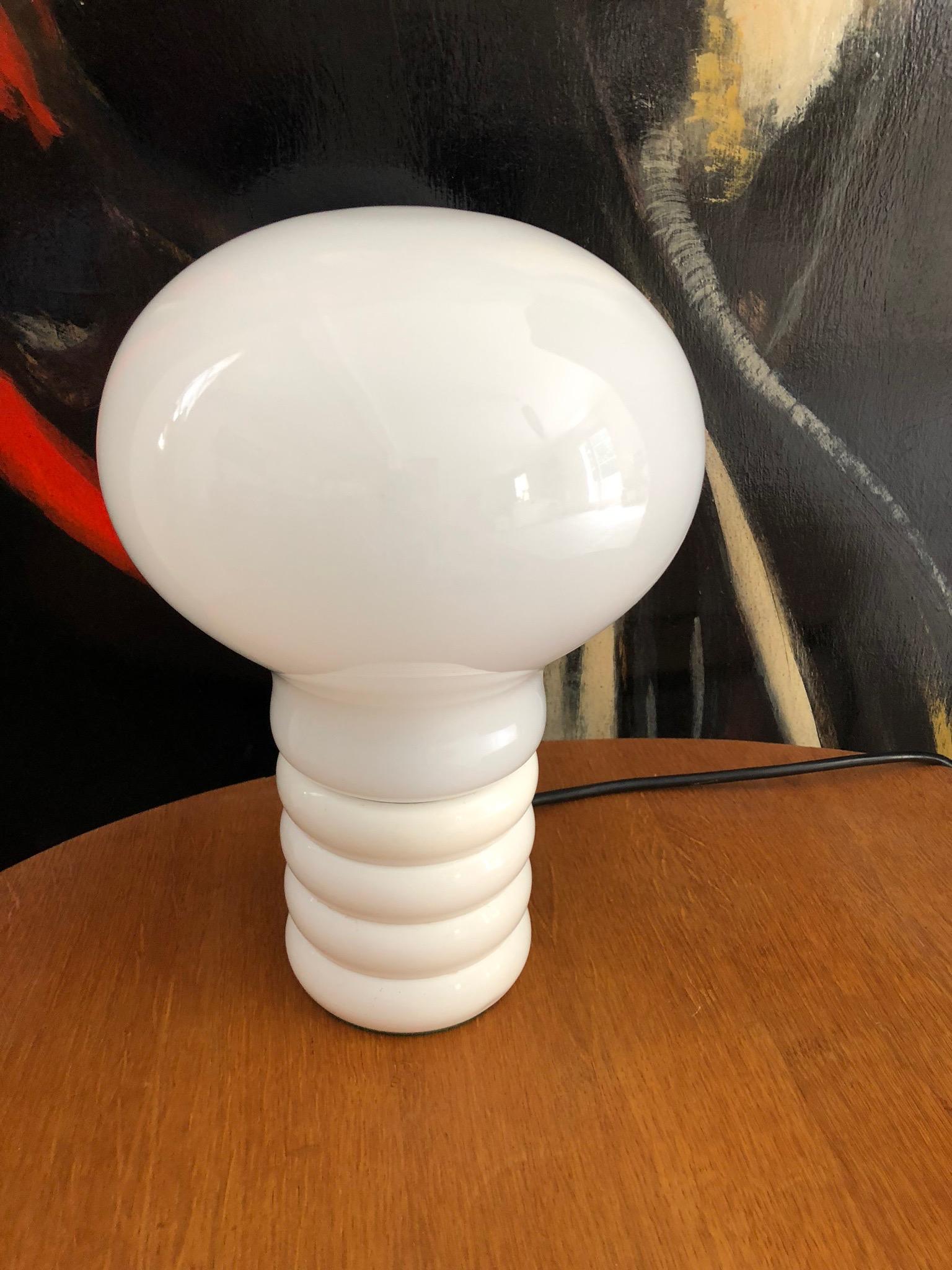 Rare and original table lamp by Ingo Maurer designed in the 1966. Base in white lacquered metal, opaline glass and white. Really good condition.