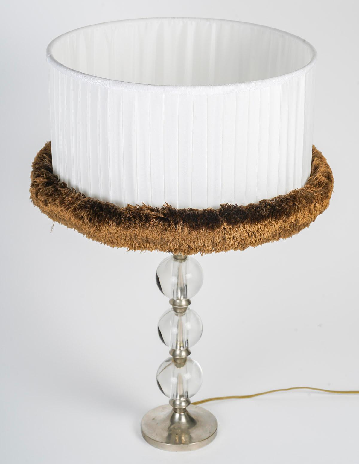 Table Lamp by Jacques Adnet in Silvered Metal and Crystal Boulle.

Table lamp by Jacques Adnet, lamp with 4 crystal balls, nickel-plated bronze base, satin and silk lampshade.  
Total: h: 62cm, d: 30cm
Lamp foot height: 40cm
