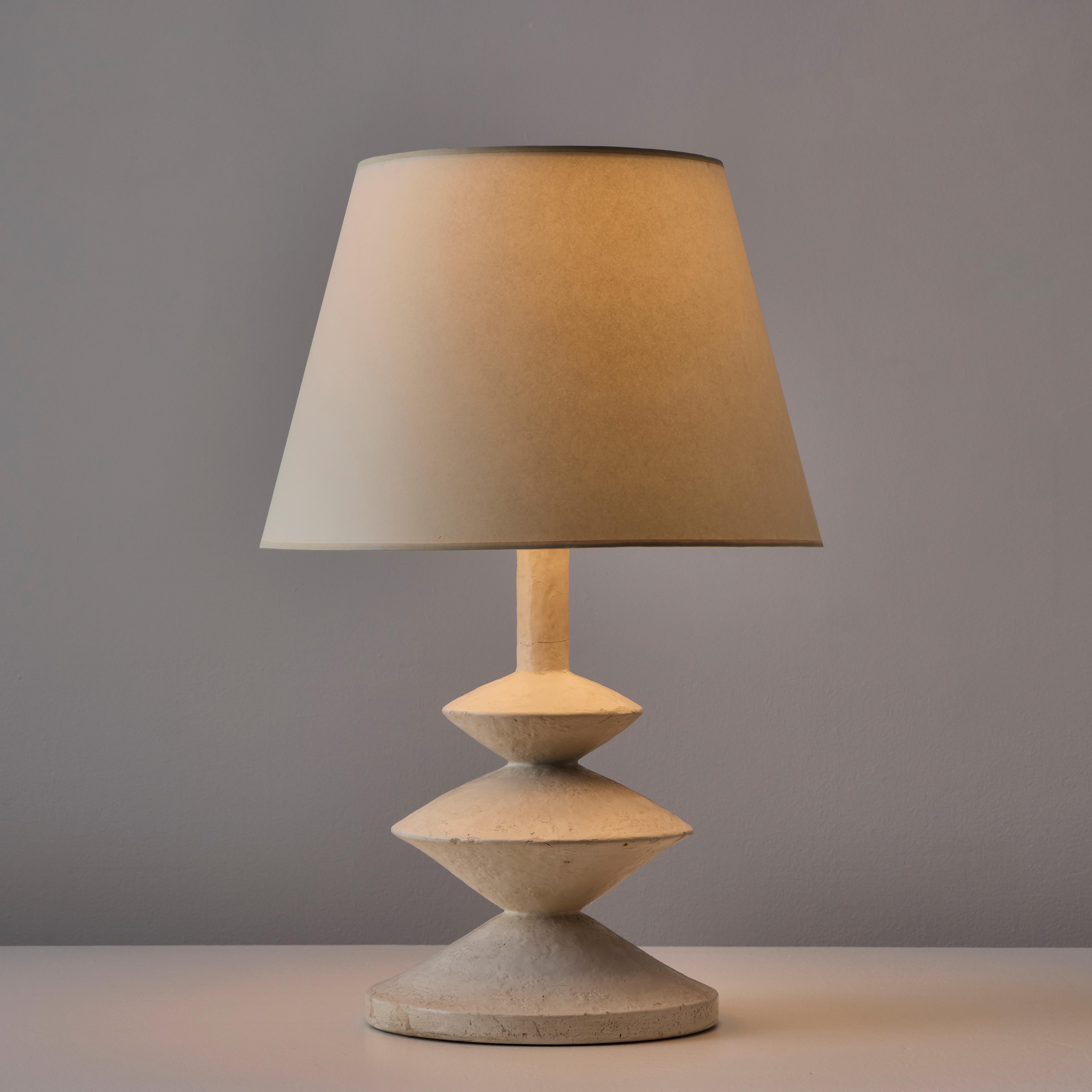 Table Lamp by Jacques Grange (Fr. 1970s)

Plaster base with three wide points in a tapered progression leading to the shade. The shade has been newly fabricated with linen. The plaster has minor chips and scratces throughout, appropriate for it's