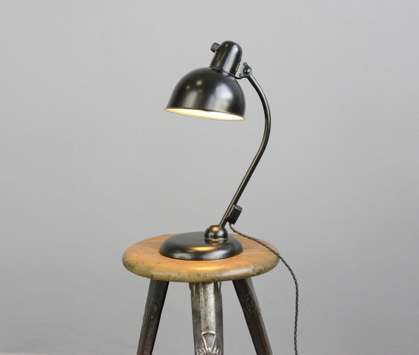 Table lamp by Kaiser Jdell, circa 1930s

- Steel shade with relief Kaiser Jdell branding
- On/Off switch on the base
- Takes E27 fitting bulbs
- Adjustable arm and shade
- Designed by Christian Dell
- German ~ 1930s
- Measures: 46cm tall x