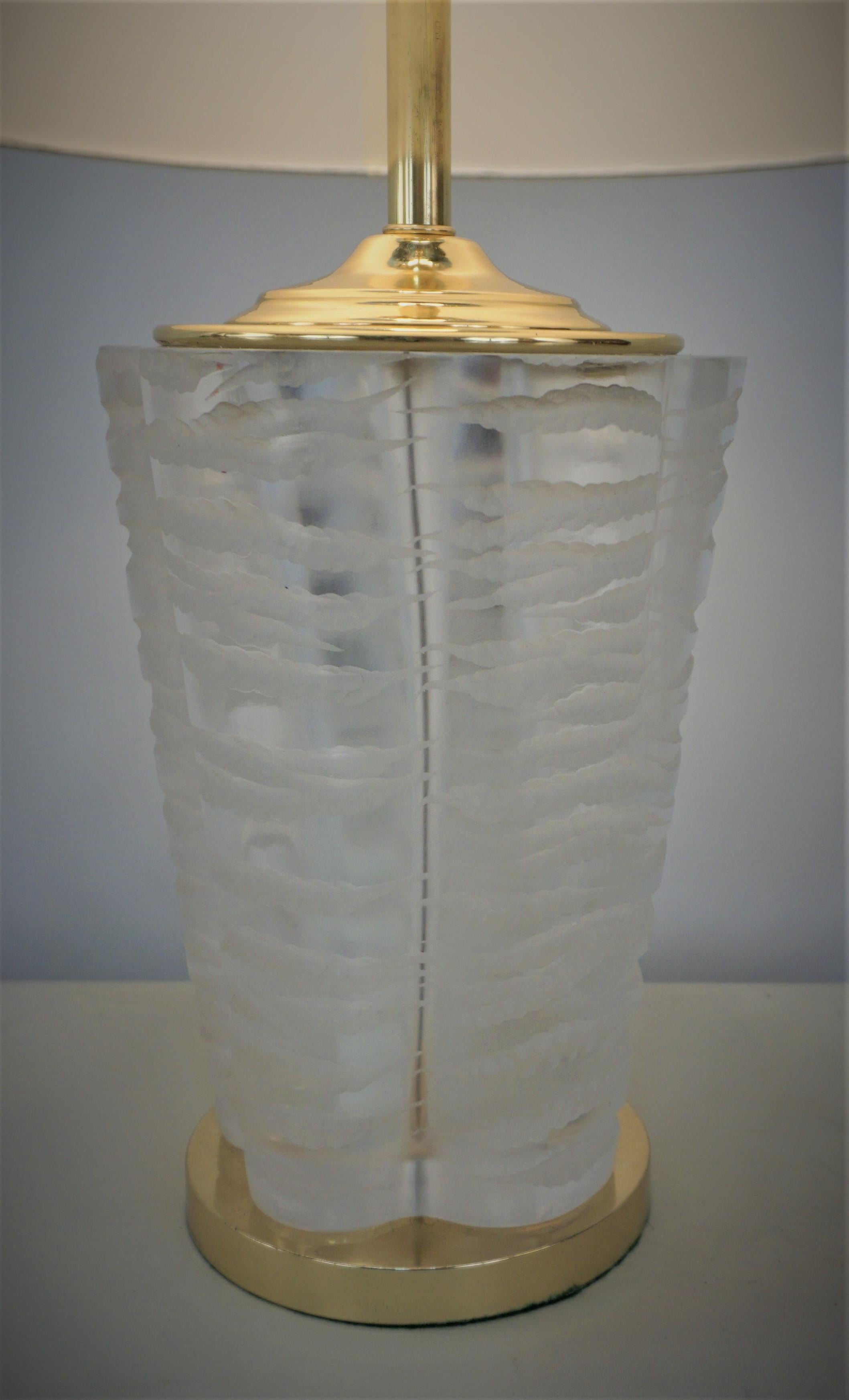 Fabulous, customized crystal table made of a heavy, six-sided clear Lalique (Marc Lalique) vase with heavy, deep frosted cuts. This exquisite piece is finished with a polished bronze base and hardware.
Fitted with hardback silk lampshade.