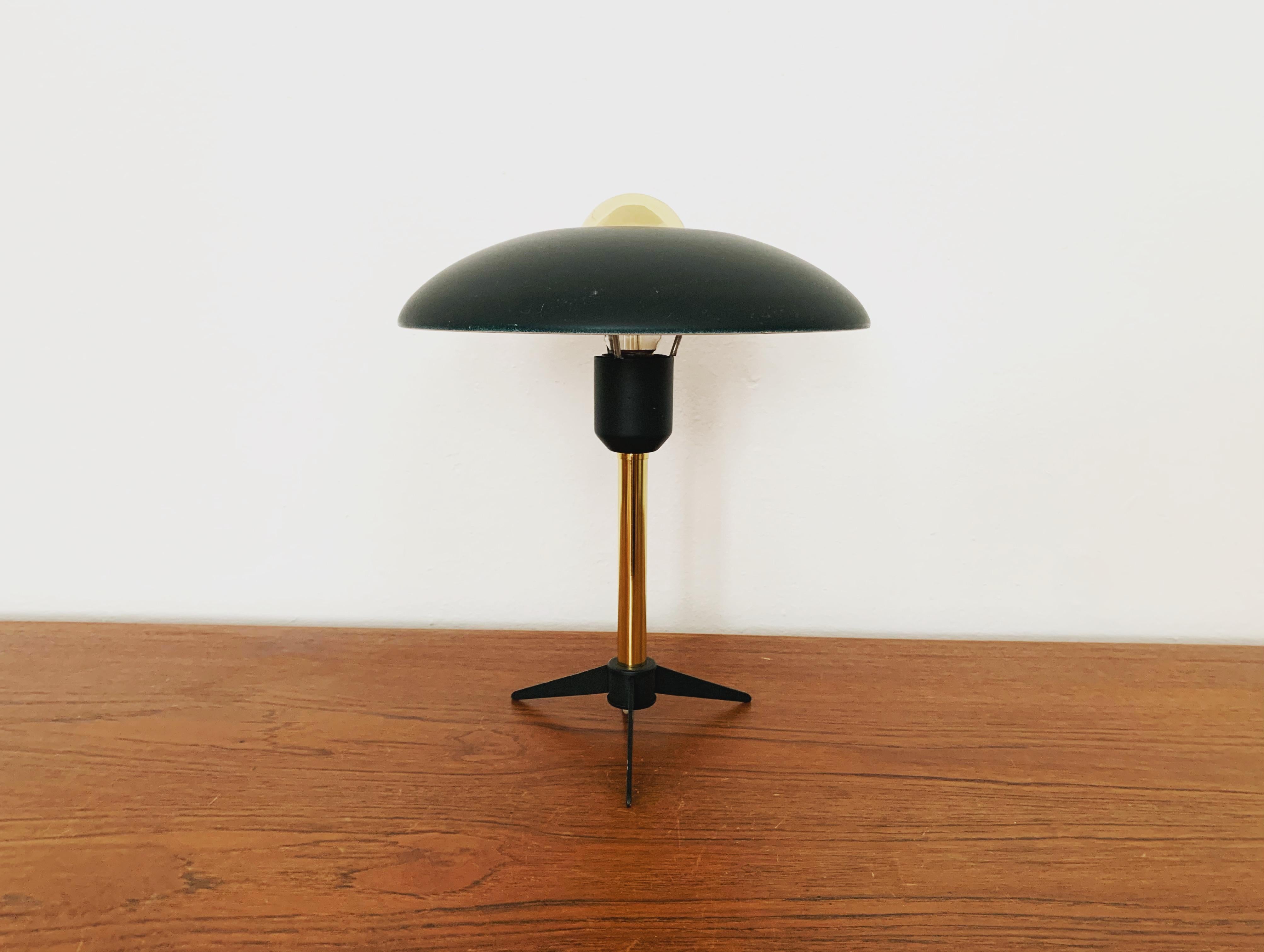 Wonderful table lamp from the 1950s by Louis Kalff.
Fantastic mid-century design.
The combination of high-quality workmanship and loving details enriches every home.

Manufacturer: Phillips

Condition:

Very good vintage condition with slight signs