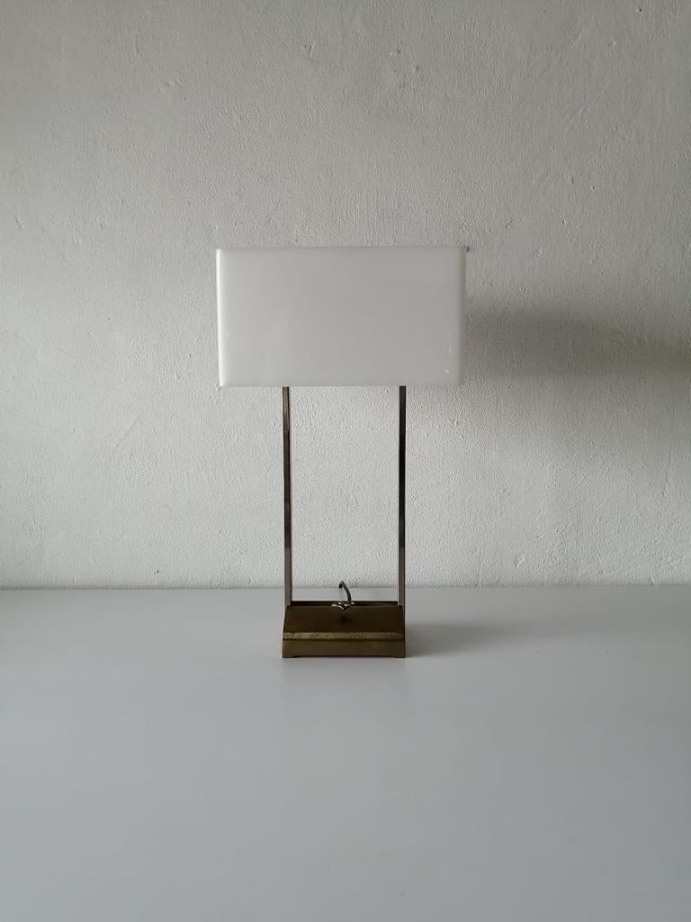 Exceptional double plexiglass shades large table lamp 
by Peter Ghyczy for Mega Watt (MT) 
1980s Netherlands
Very high quality. 
Base is made of solid brass.
Chrome body and legs
The base is stamped with the Ghyczy mark.
Lampshade made of