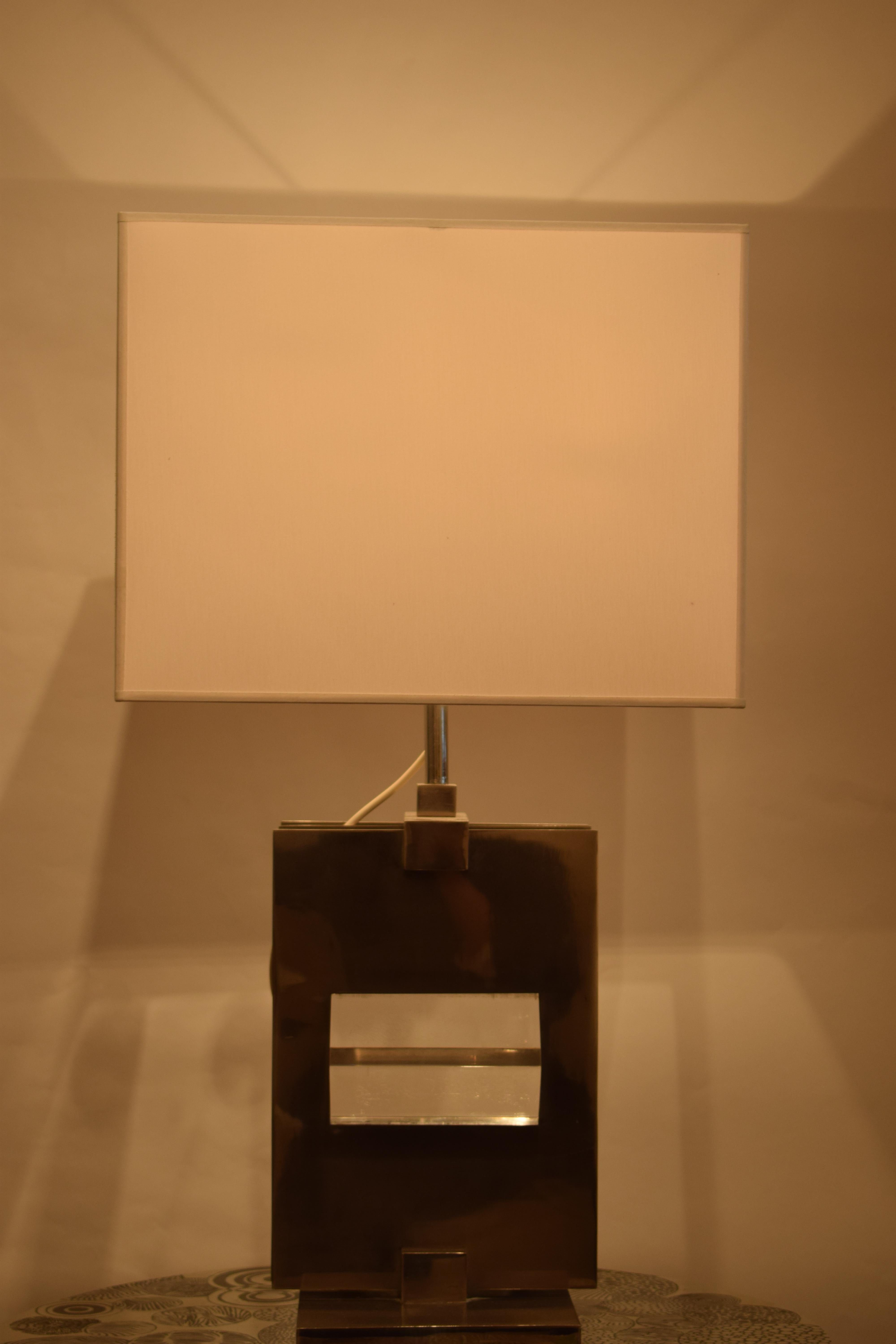 Impressive geometric design table lamp in Plexyglass and chrome by Romeo Rega.
      