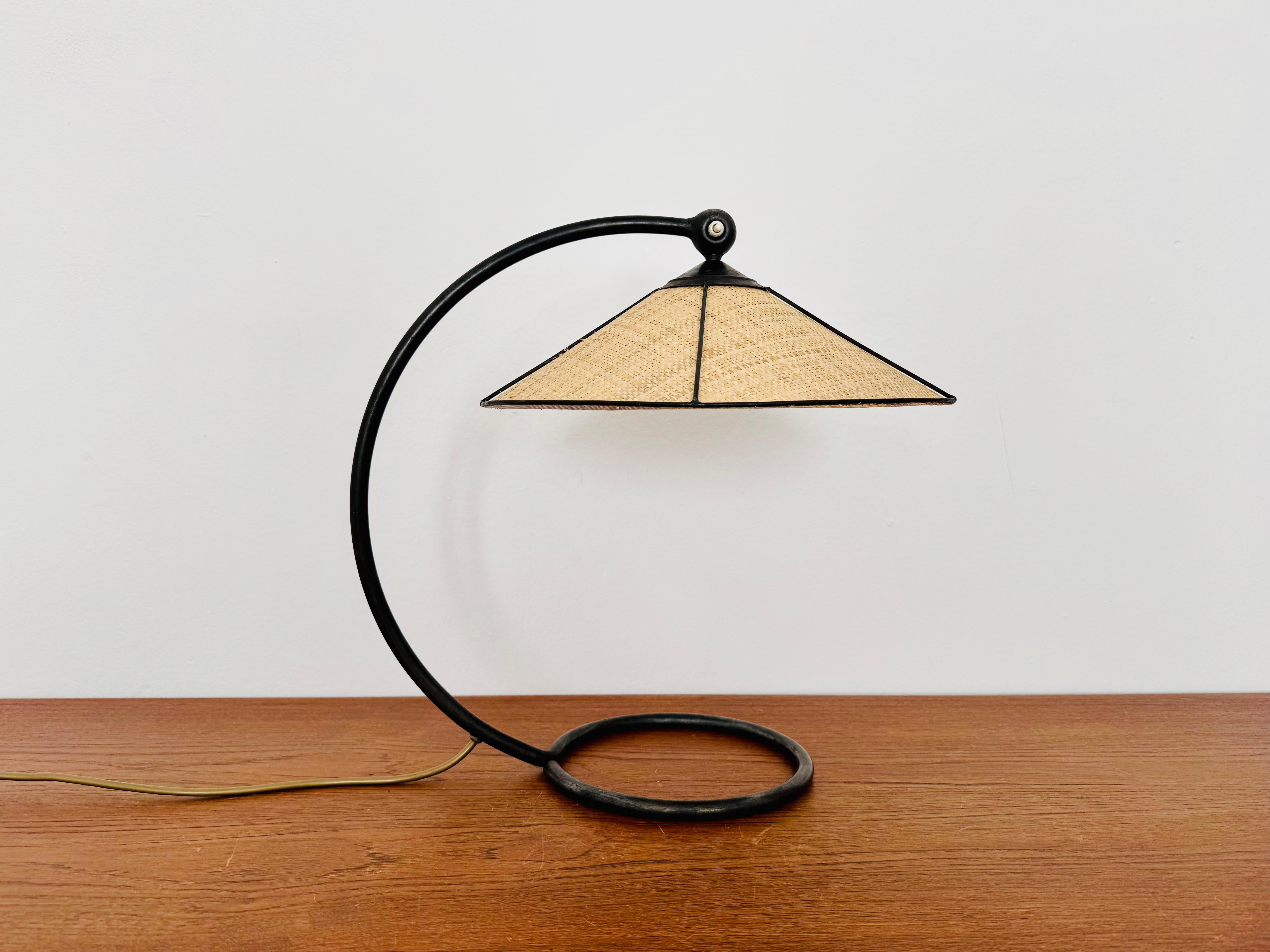 Wonderful table lamp from the 1950s.
Great and unusual design with a fantastically elegant appearance.
The seagrass lampshade creates a very cozy atmosphere.

Design: Rupert Nikoll

Condition:

Very good vintage condition with slight signs of