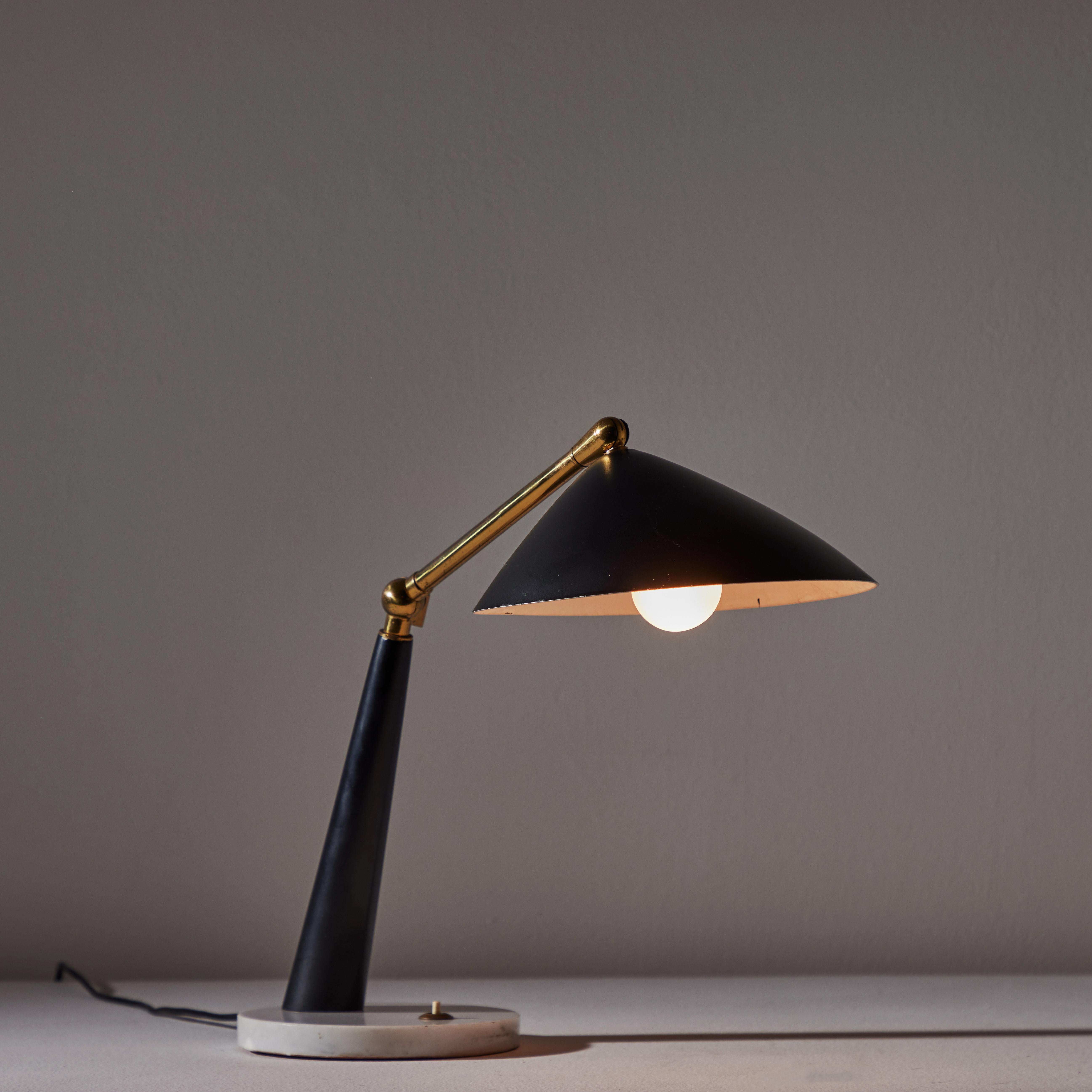 Table lamp by Stilux. Designed and manufactured in Italy circa the 1960s. Painted black aluminum shade and stem with a marble base. Stem and shade are on pivot swivels, allowing for alternate positions. Holds one E27 socket type. Bulb recommendation