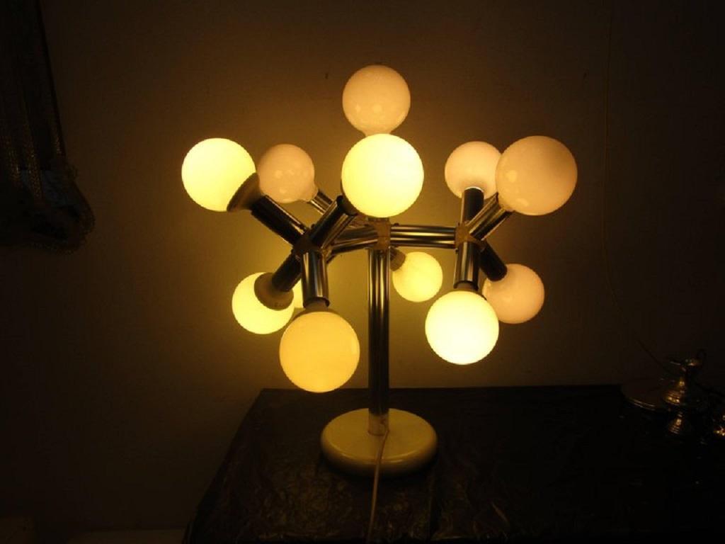 Table lamp with thirteen lights metal structure and plastic joints base in white metal.
