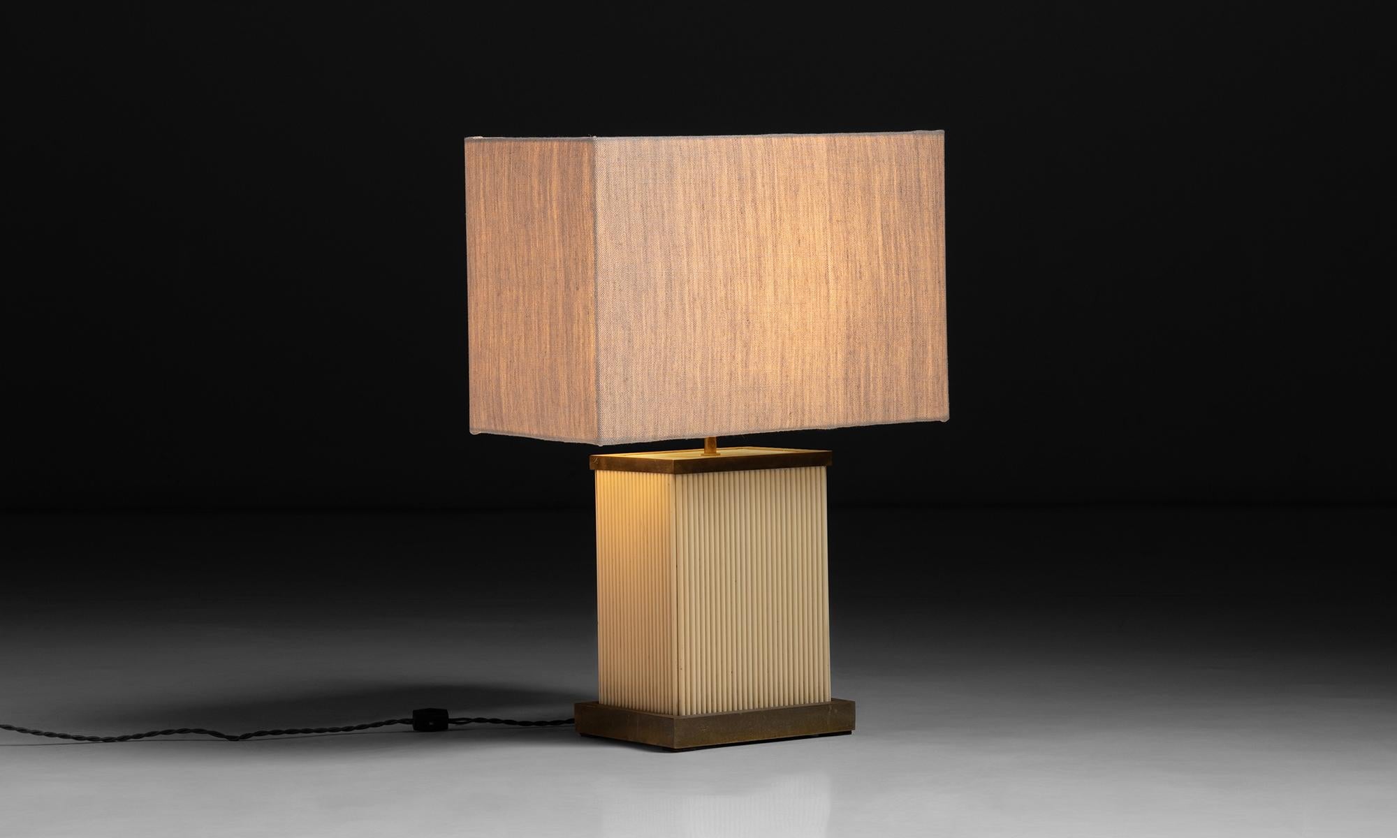Table lamp by Tomasso Barbi.

Italy circa 1980

Brass & plastic base with neutral shade.

Measures: 17.25”L x 9.25”D x 24”H.
