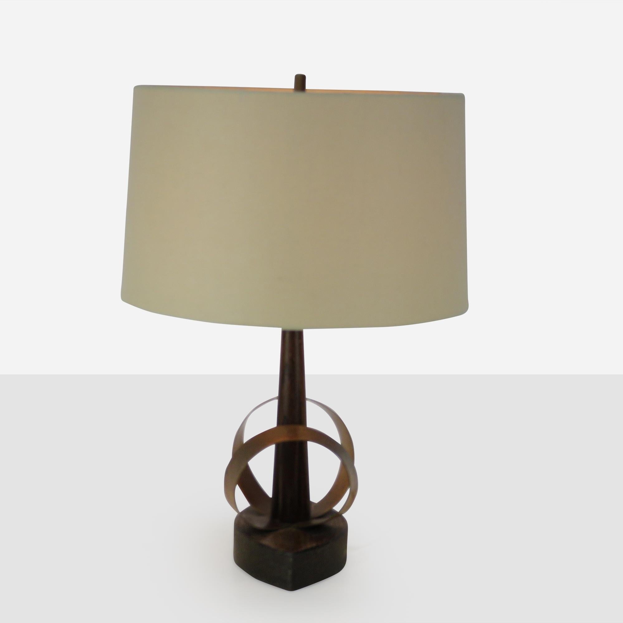 Hand hammered and bent copper and oak table lamp by Yasha Heifetz.