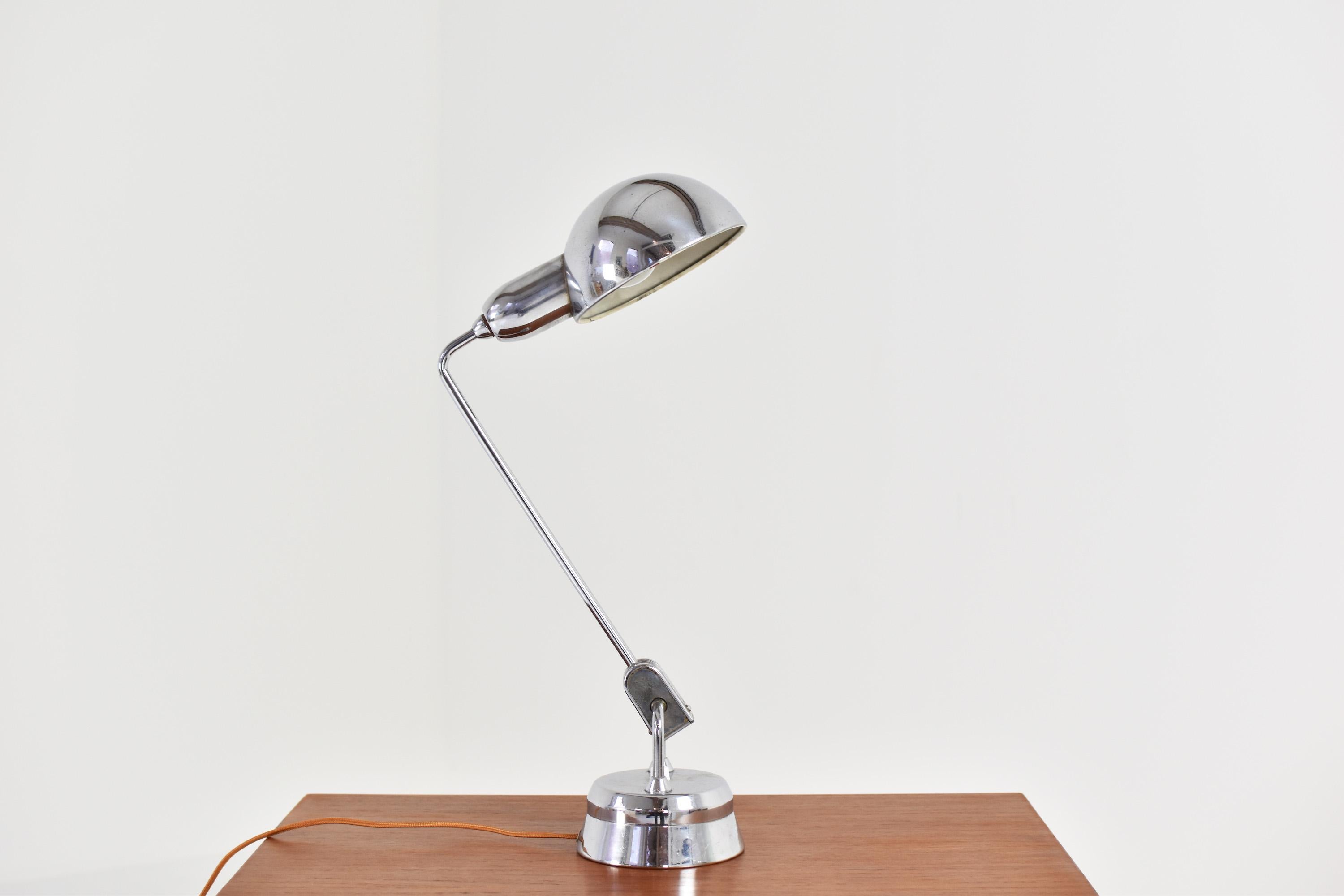 Table lamp designed by Yves Jujeau and André Mounique for Maison Jumo, France, 1940’s. This is model Jumo 600 and has an adjustable domed shade and pivoting shaft on a weighted round base with integrated switch. Favored for their exemplary quality