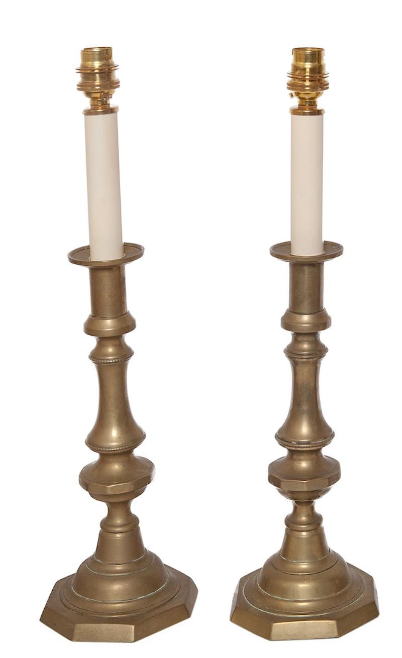 A pair of 19th century, brass candlesticks, upcycled into table lamps, 46cm, 18” high

Practical and suitable for everyday use.
The brass has developed a mellow, patina which can be polished if required.
Blends and sits comfortably in period ,
