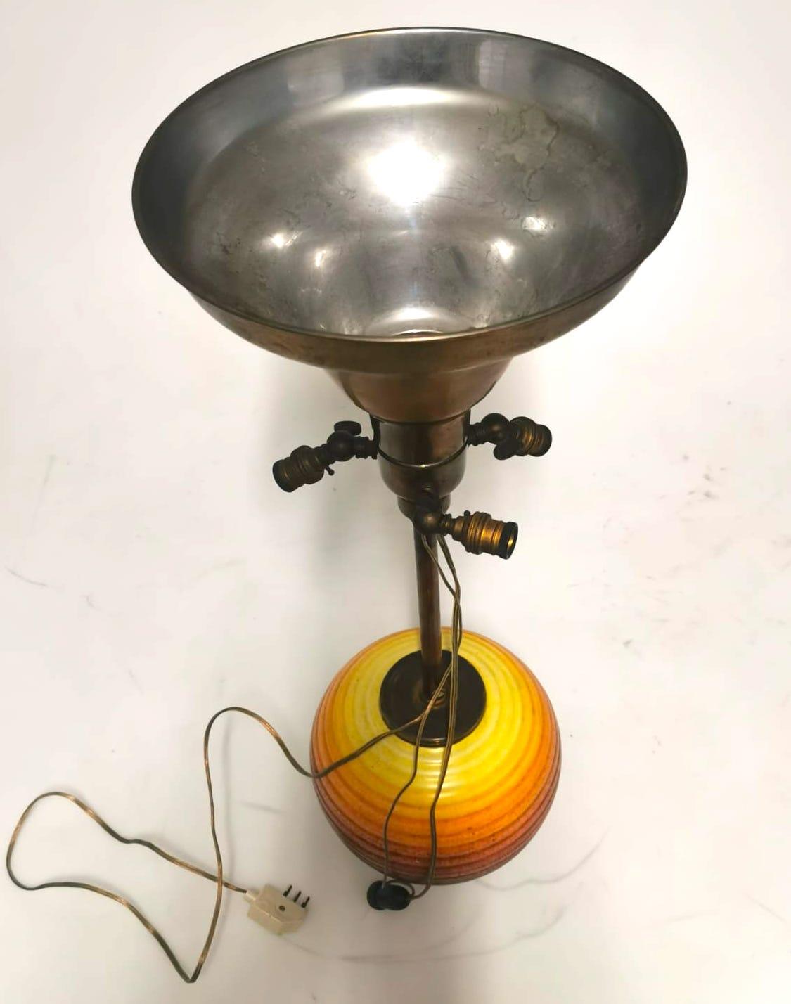 Precious table lamp, made in ochre glazed ceramic and brass, realized in 1930s.

In very good condition except for some signs of aging. 

With the ‘MGA’ brand.

This object is shipped from Italy. Under existing legislation, any object in Italy