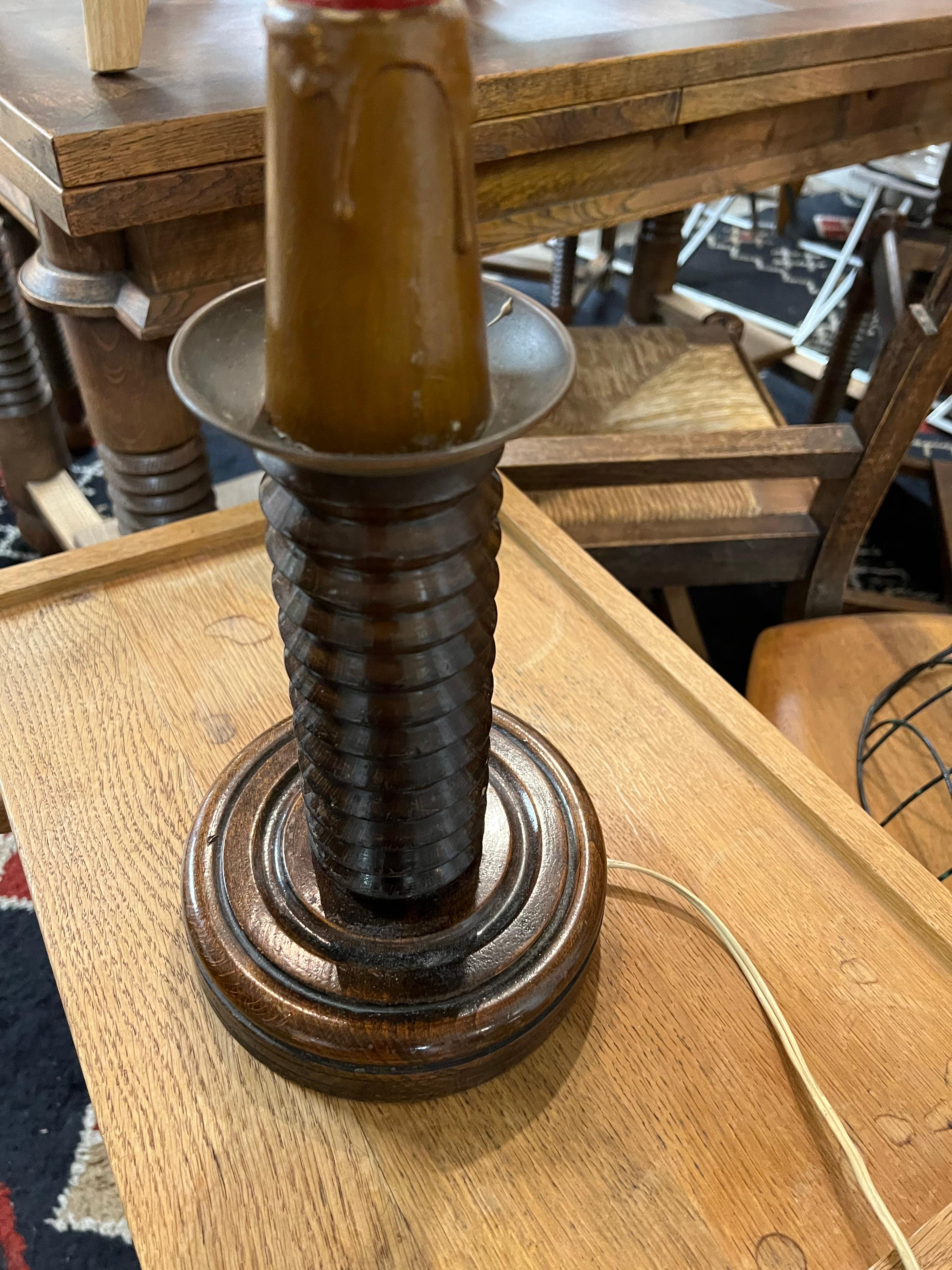A mid century oak table lamp.