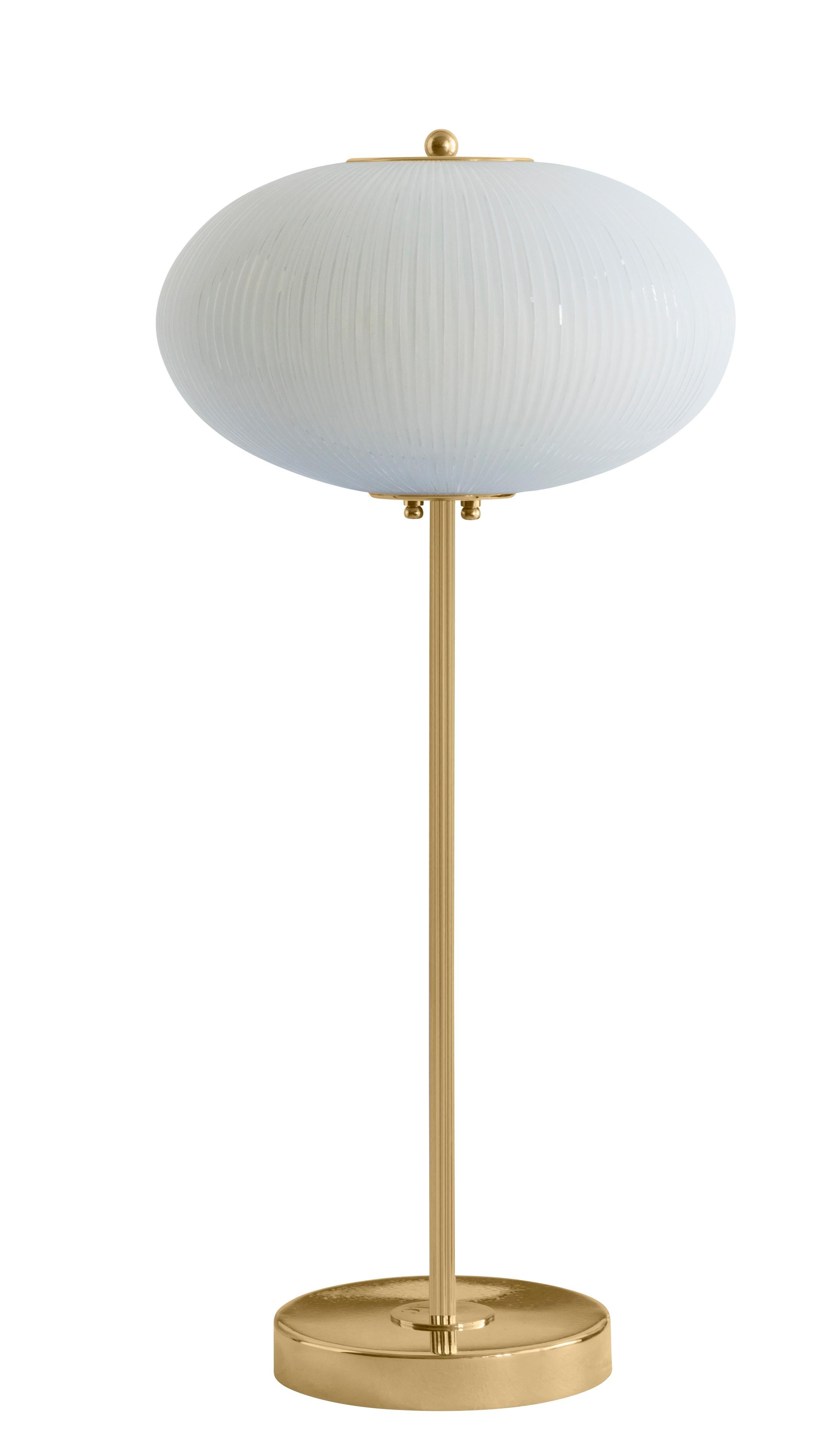 Table lamp China 07 by Magic Circus Editions
Dimensions: H 70 x W 32 x D 32 cm
Materials: Brass, mouth blown glass sculpted with a diamond saw
Colour: rich grey

Available finishes: Brass, nickel
Available colours: enamel soft white, soft