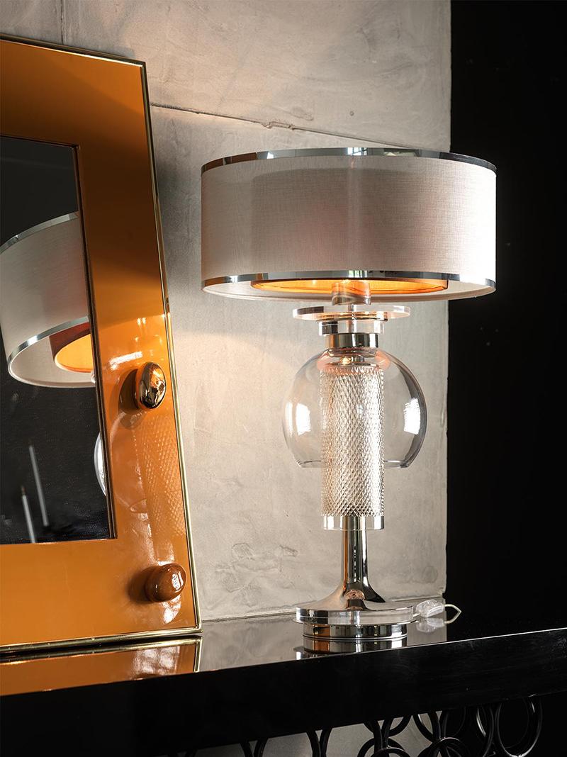 Crystal lamp composed with nickel-plated brass and Plexiglas. The lampshade is double, outside in fine silver fabric and inside in amber silk.