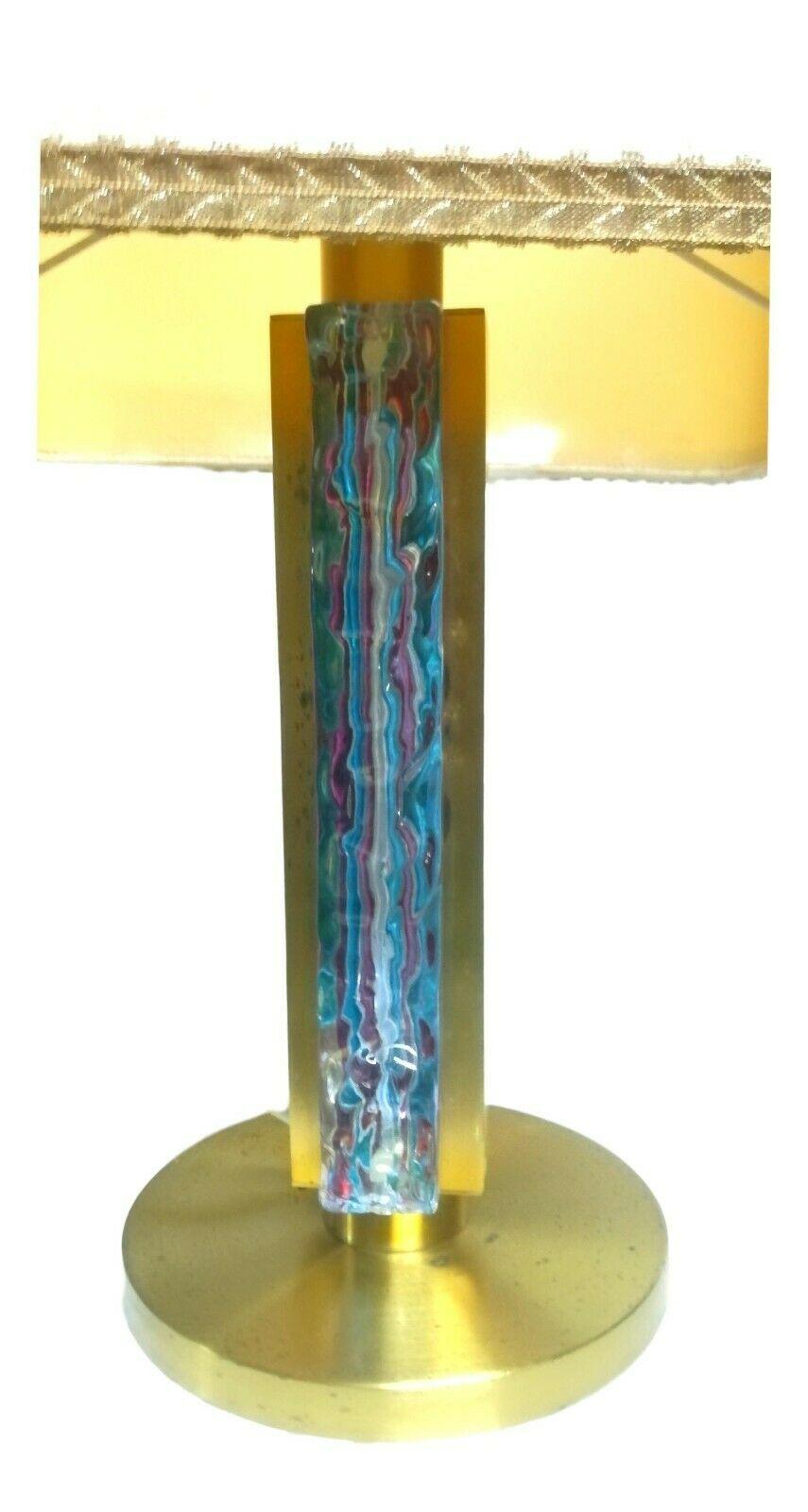 Table lamp made by esperia , designed by angelo brottomurano worked and multicolored in shades of blue

It measures approximately 60 cm in overall height, the hat 36x36 cm

Very good condition, as shown in photos, intact and perfect glass,