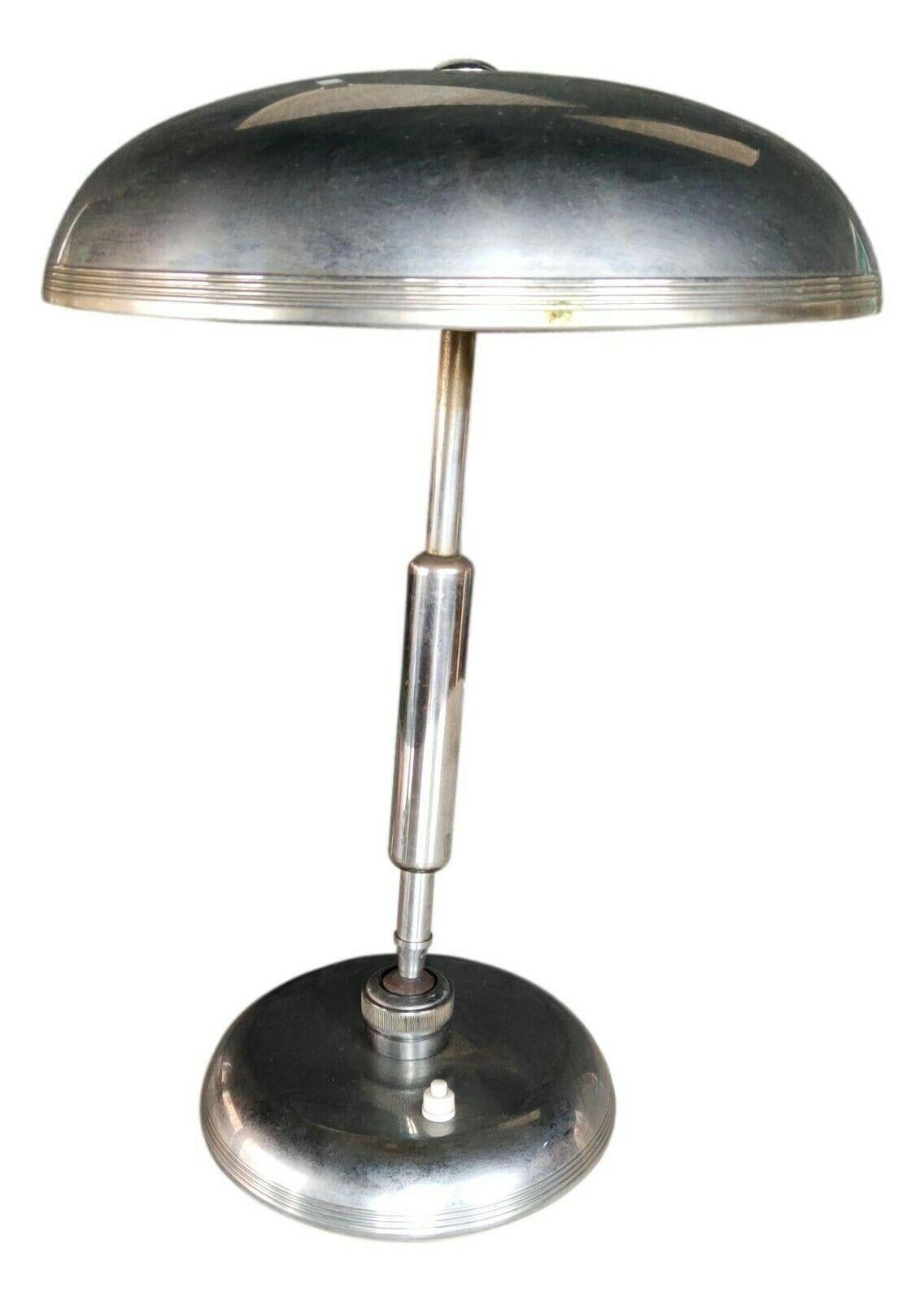 Iconic original table lamp produced by Lumi Milano based on a design by oscar torlasco , published several times on all specialized sites

made of metal, with base and diffuser oscillating in all positions, measuring 43 cm in height, diameter of