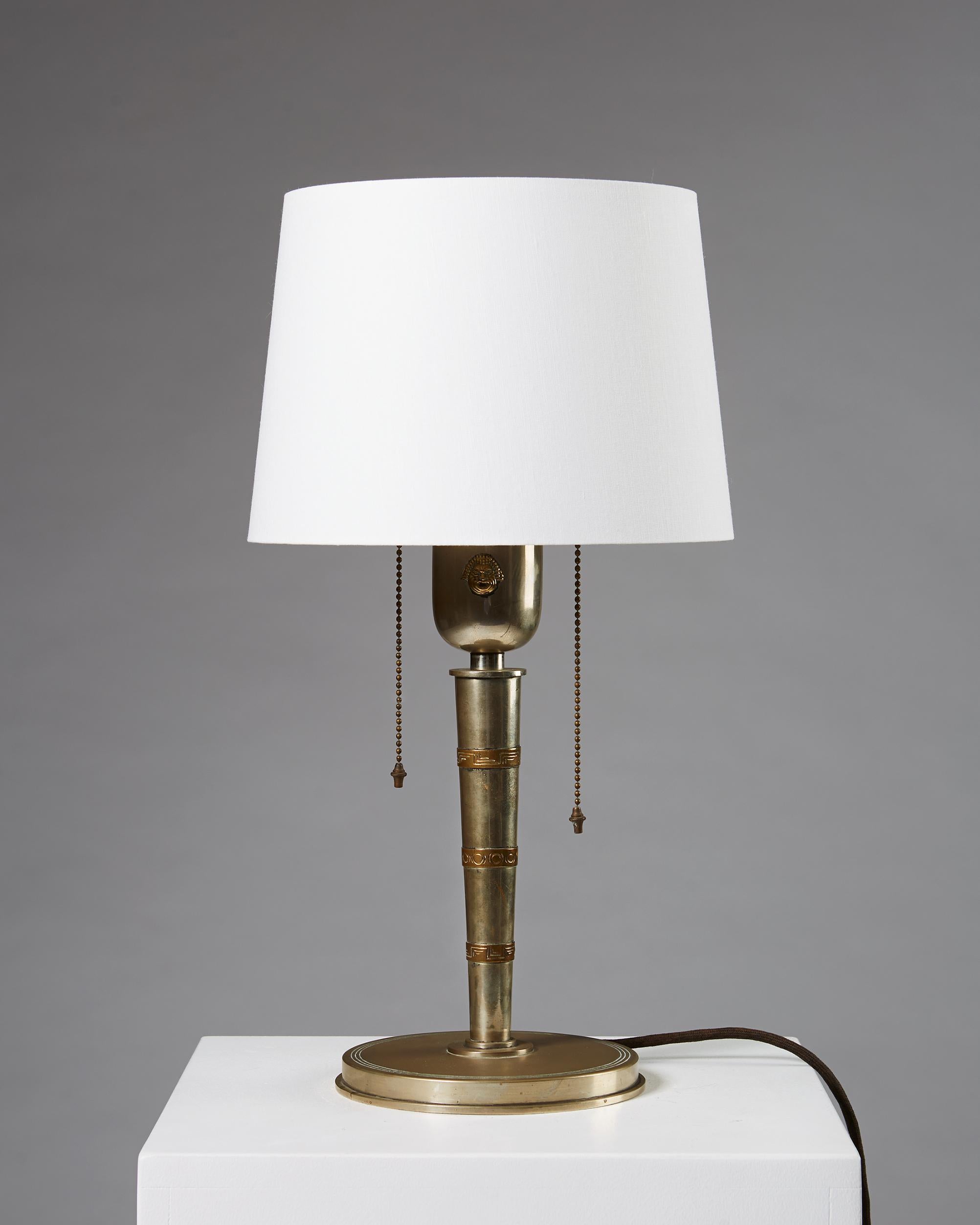Table lamp designed by Tore Kullander,
Sweden 1930s. 

Pewter and brass with a textile shade.

Measurements:
H: 51 cm / 1' 8 3/4
