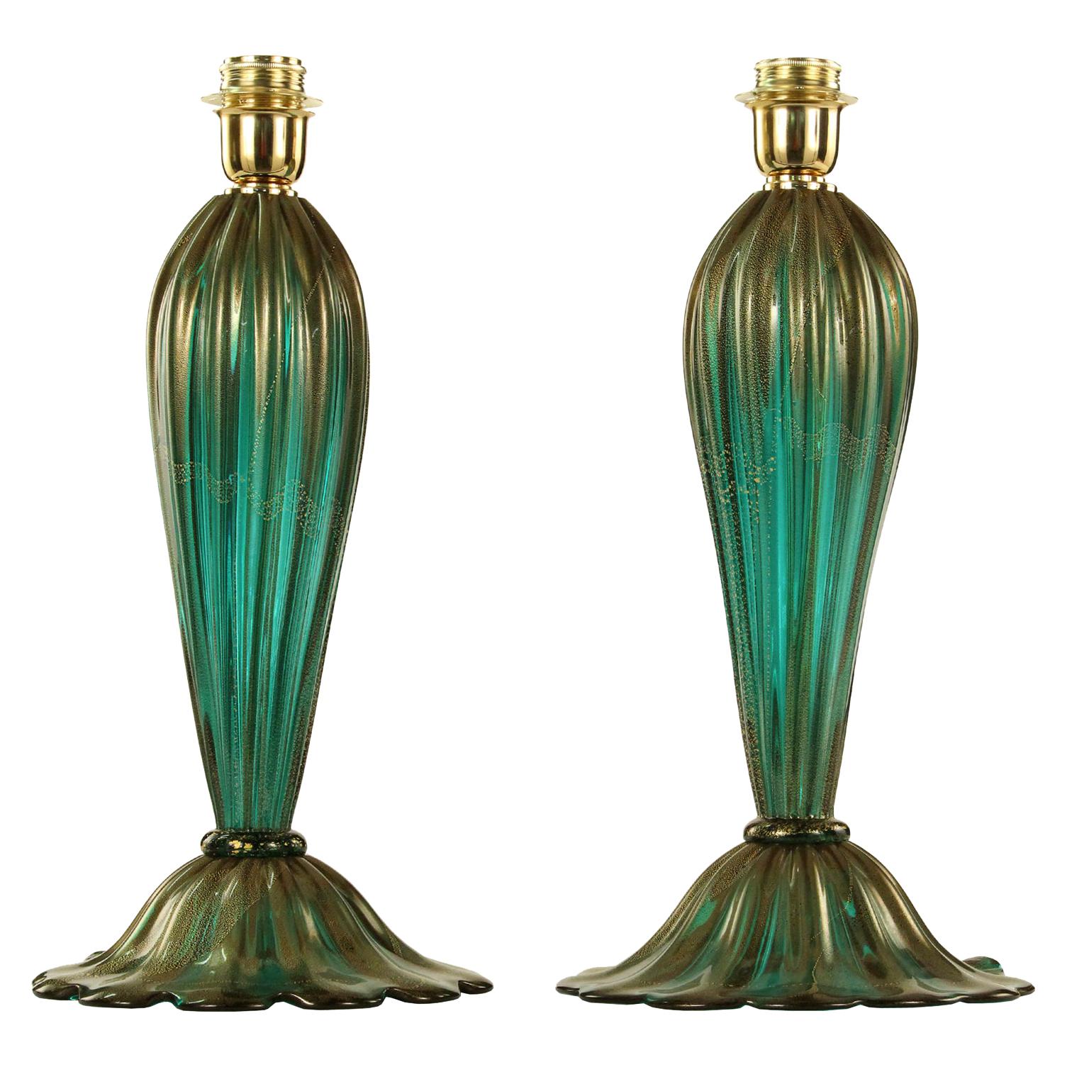 One table lamp with emerald colour with golden leaf artistic Murano glass 

The price doesn't include the lampshade that on request will be quoted apart.

ø 23 cm, h 46 cm

The handcrafted soul of our lighting products is reinvented every time we