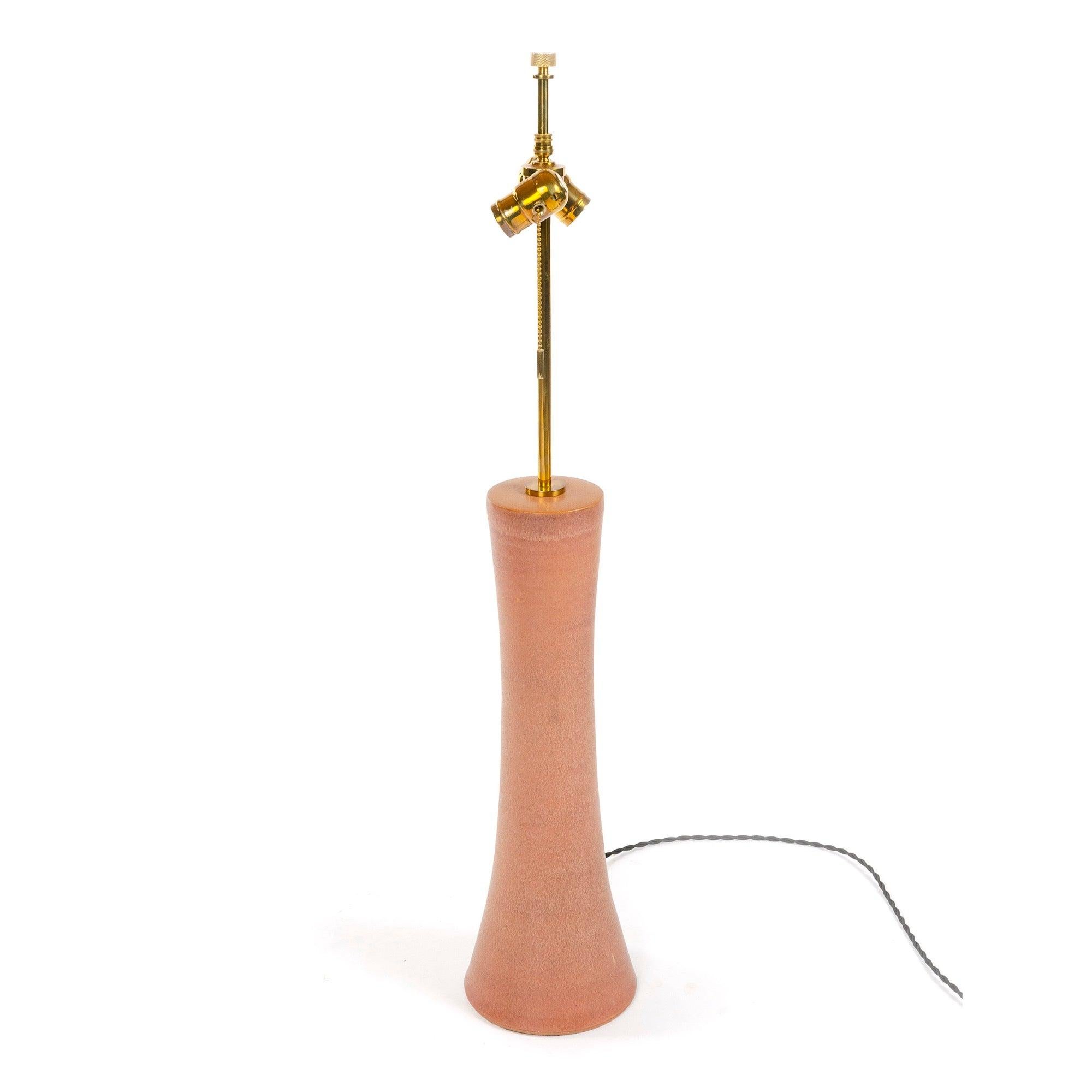 Based on Rosen's earlier ceramic forms, the hand thrown â€˜3300 Series' of 1967 expanded the types of hand applied glazes with an enlarged palette of colors and glaze techniques. Sold without shade.