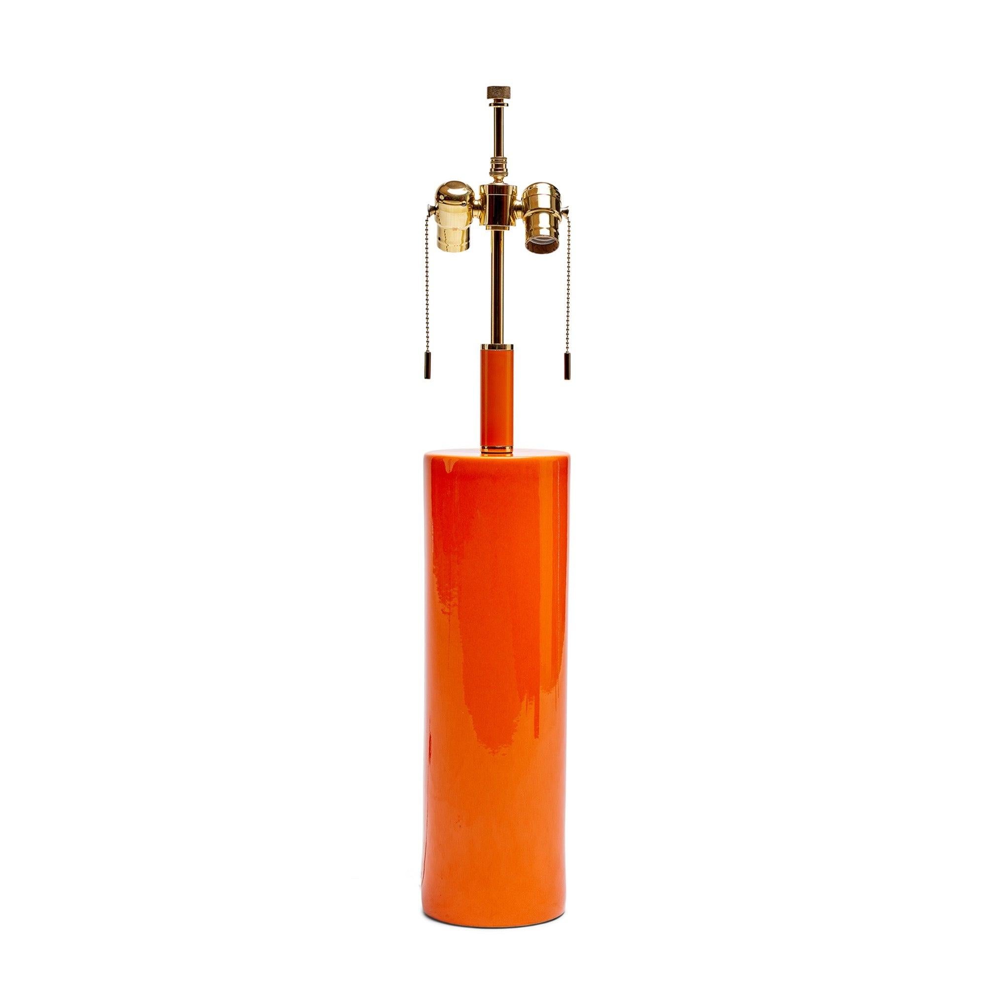 Orange glazed table lamp. Shade is priced separately.