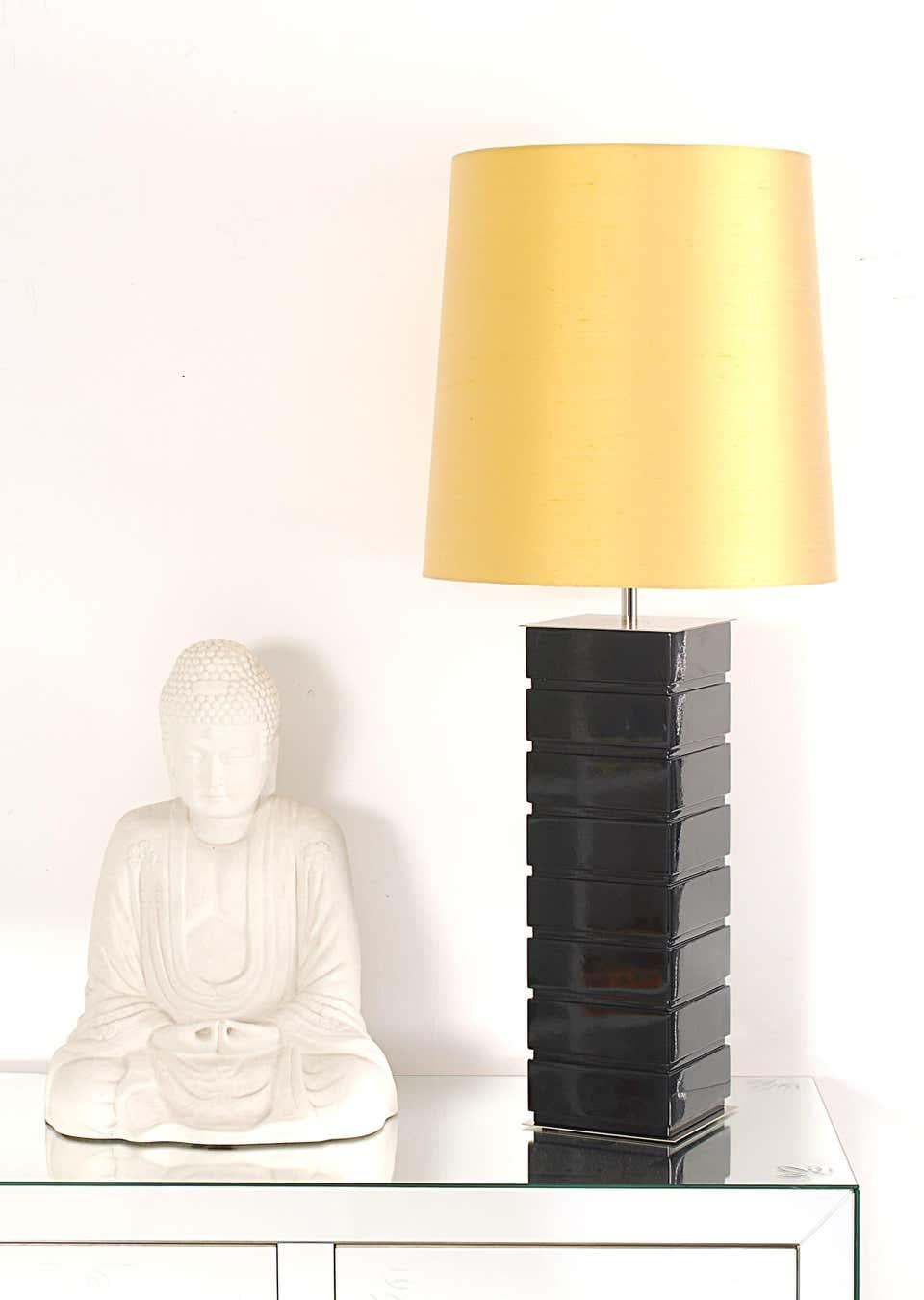 Table lamp
Lacquered wood,
The lampshade is available in either fabric or silk in yellow, midnight blue or pure white.
Measures: Height 19.69 in. (50 cm)
Width 5.91 in. (15 cm)
Depth 5.91 in. (15 cm)

Estimated production time:11-12 weeks.
 