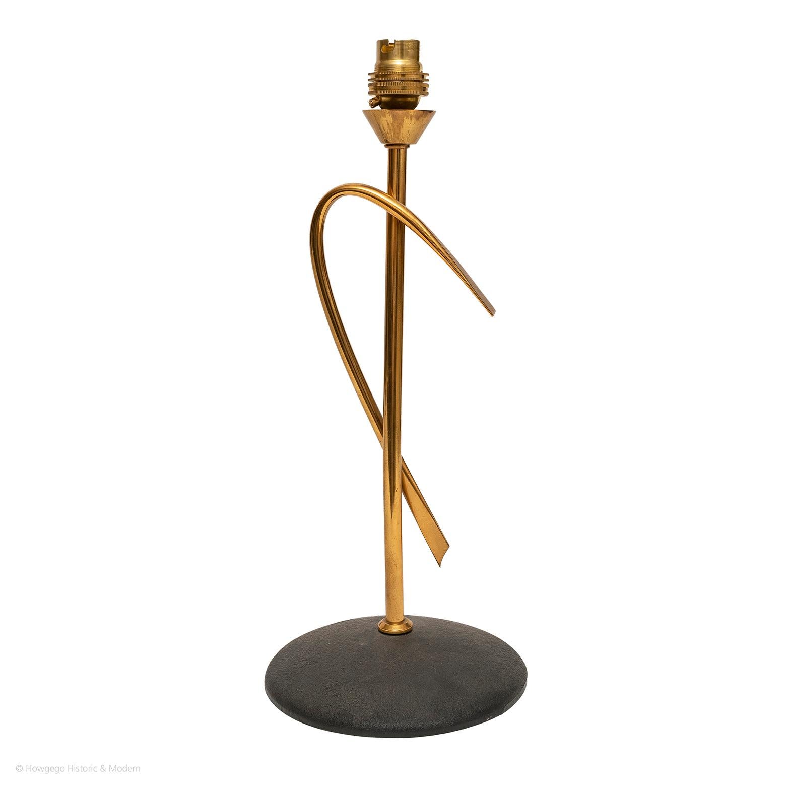 A Stylised, Mid-Century Modern, French brass and black metal, arc, table lamp
The brass arc creates a classic yet stylised aesthetic, inspired by a design by Jean-Michel Frank
Classic modern elegance which will blend and sit comfortably in period,