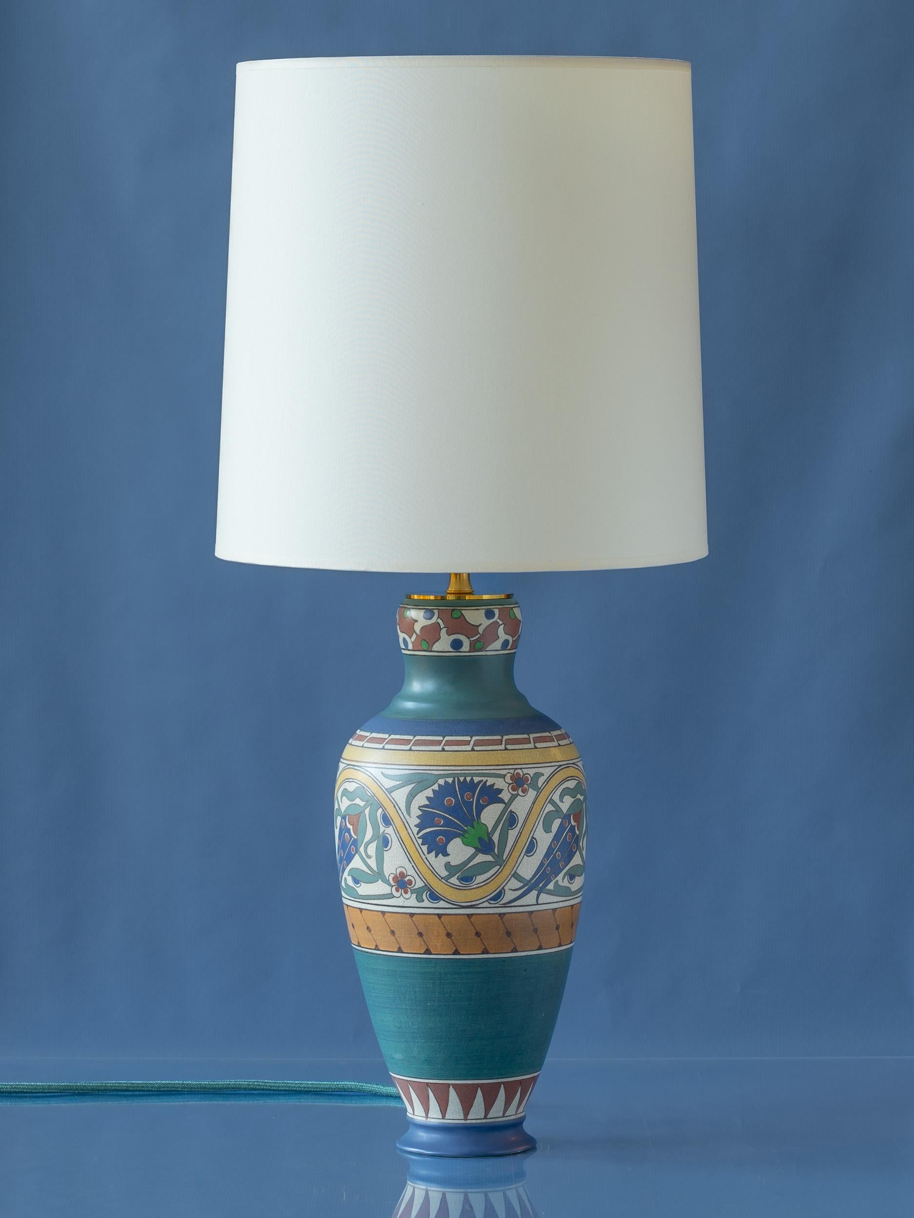 Meticulously handcrafted by Amitābha Studio in Amsterdam from an antique Arnhemsche Fayencefabriek vase (circa 1910-1917), Lindus is a one-of-a-kind table lamp that exhibits characteristics of both Art Nouveau and early Art Deco styles. This unique