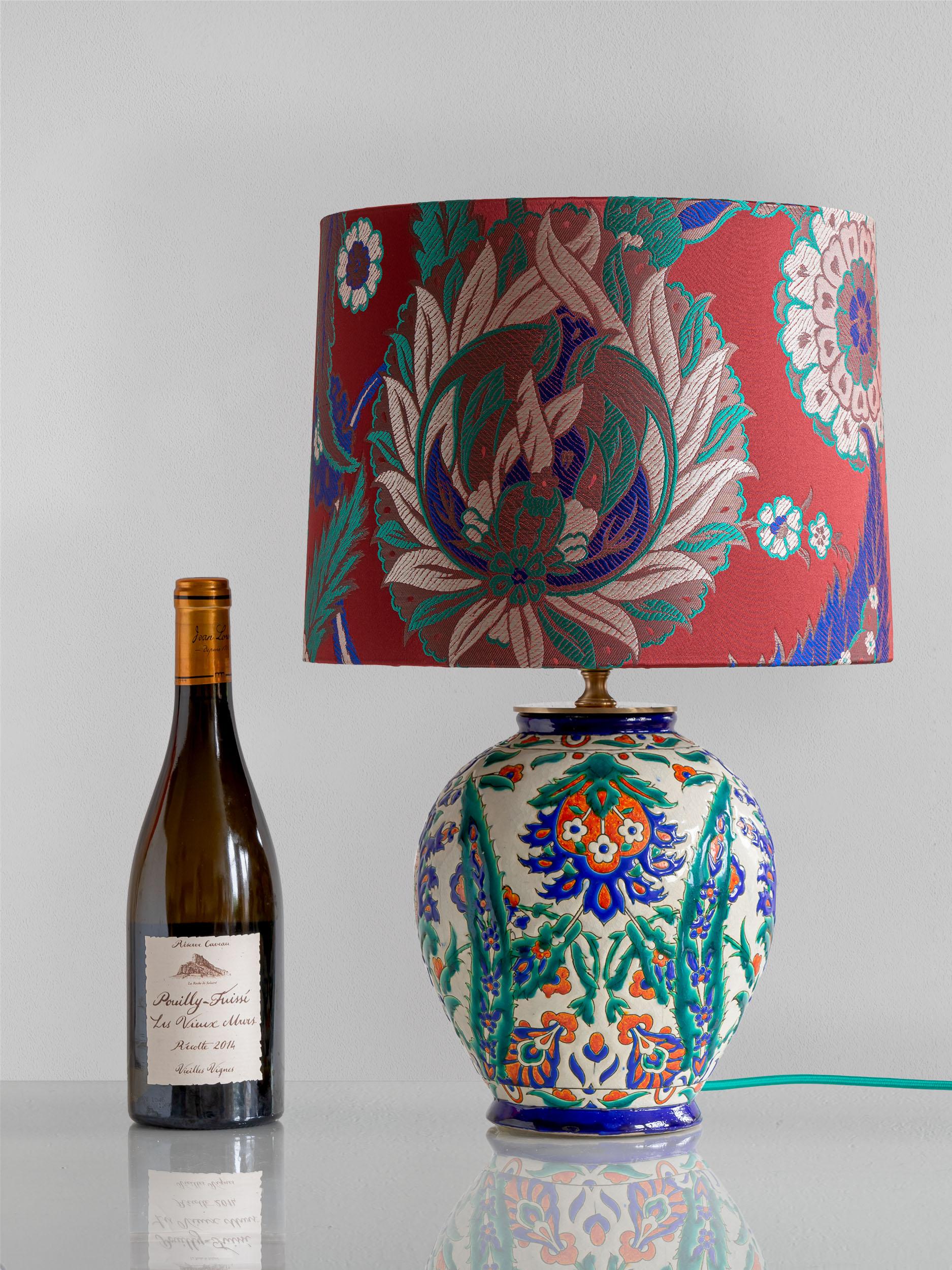 Meticulously handcrafted by Amitābha Studio in Amsterdam from an antique ceramic cloisonné vase designed by Raymond Chevallier, Askania is a one-of-a-kind table lamp. Originating from the Boch Frères Keramis in La Louvière, Belgium, this exquisite