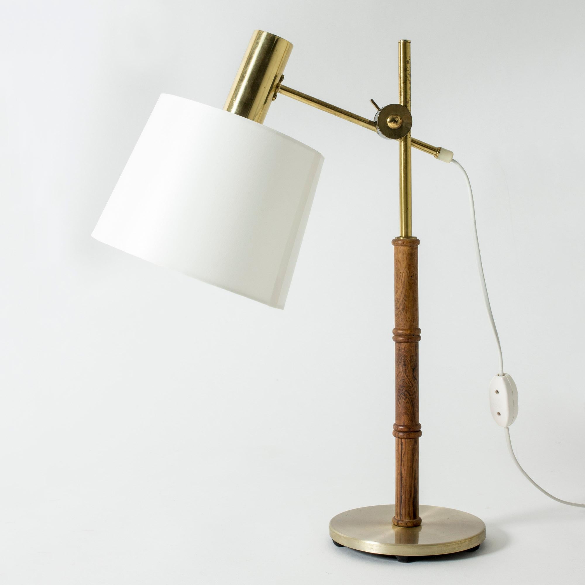Cool table lamp from Falkenbergs Belysning, made from brass with a rosewood stem. Wood carved into a bamboo-stem form. Adjustable height and angle of the shade.