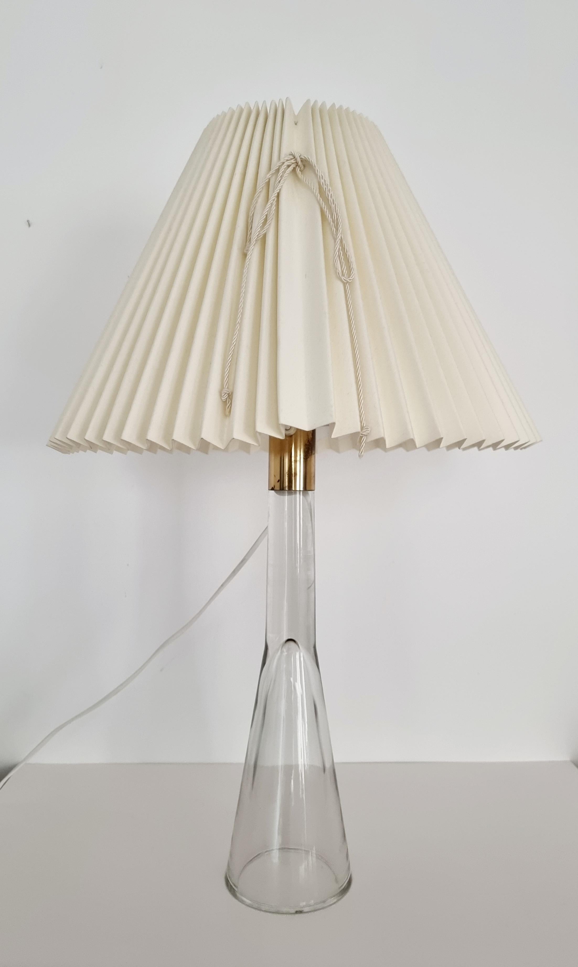 Table lamp in glass designed by Lisa Johansson-Pape for Orno oy. Glass is handmade/free blown att Iittala, Finland. Model Mademoiselle / Lady / 40-013. In beautiful condition. 

This model is designed in 1954, this example is most likely produced